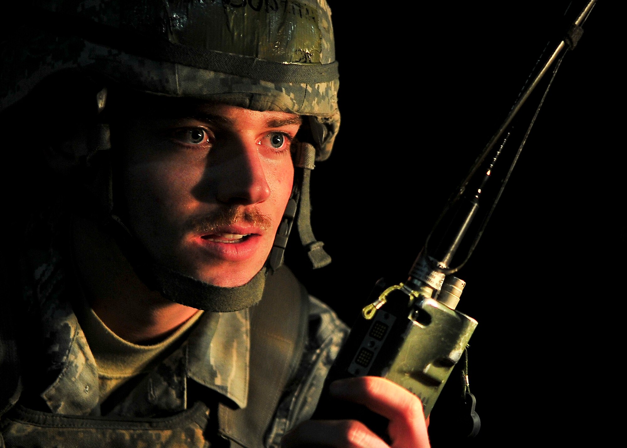 Airman 1st Class Keith Munson, 51st Security Forces Squadron member, calls in a radio check after laying down concertina wire, March 18, 2012 during exercise Beverly-Midnight 12-01. Exercises like this test Osan Airmen's ability to survive and operate in a wartime environment and also tests their ability to plan and execute an exercise. (U.S. Air Force photo/Senior Airman Adam Grant)