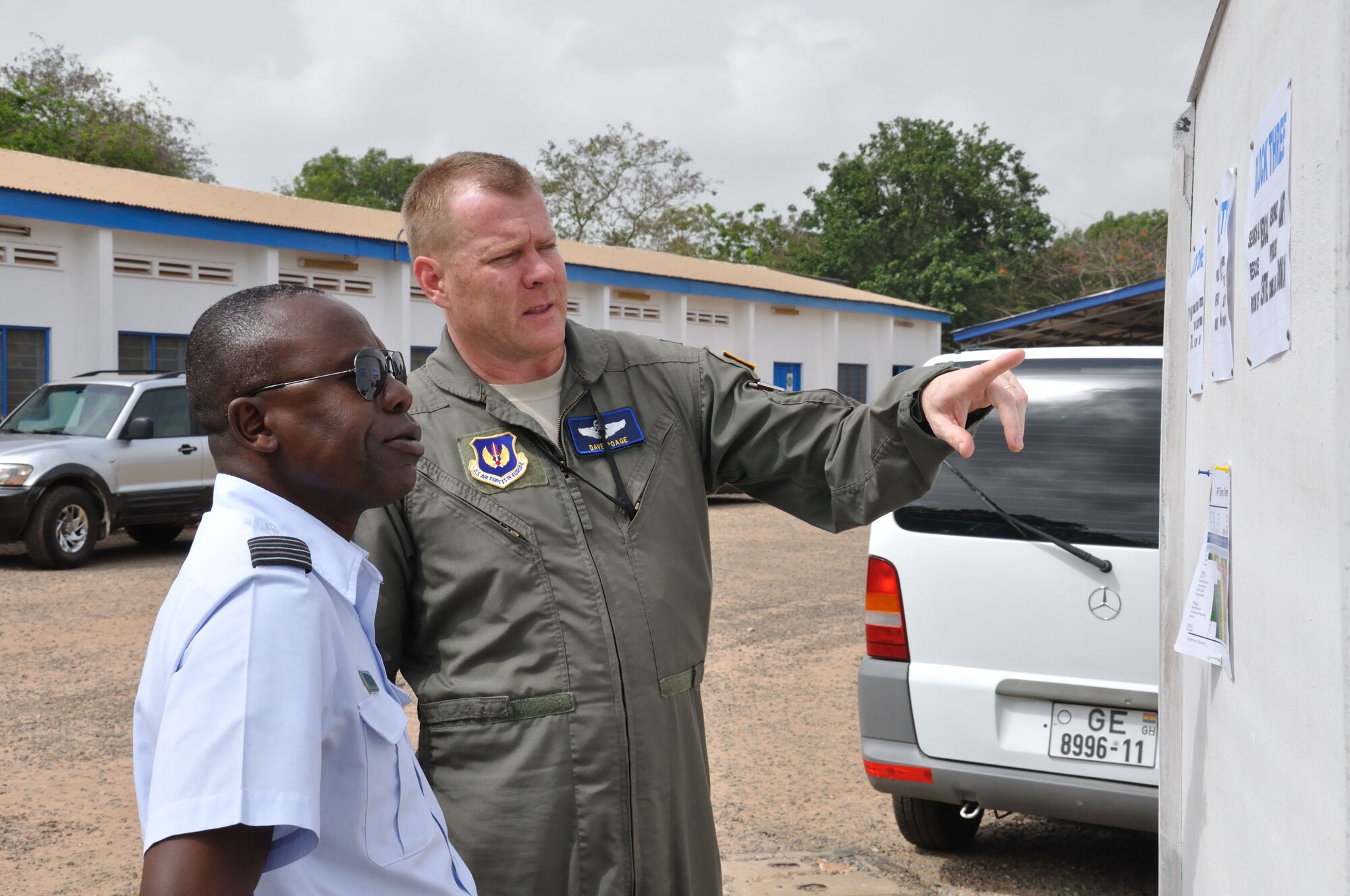 Col. Dave Poage, African Partnership Flight mission commander, and Ghana air force Wing Cmdr. Frank Hanson, C-295 pilot, discuss the various classes going here during APF March 12. Over a two-week period, servicemembers from Ghana, Togo, Benin, Nigeria, Senegal and the United States will have the opportunity to share experiences in a wide number of topics related to air mobility, as well as improve on relations as friends and allies. (U.S. Air Force photo by Staff Sgt. Brok McCarthy/Released)