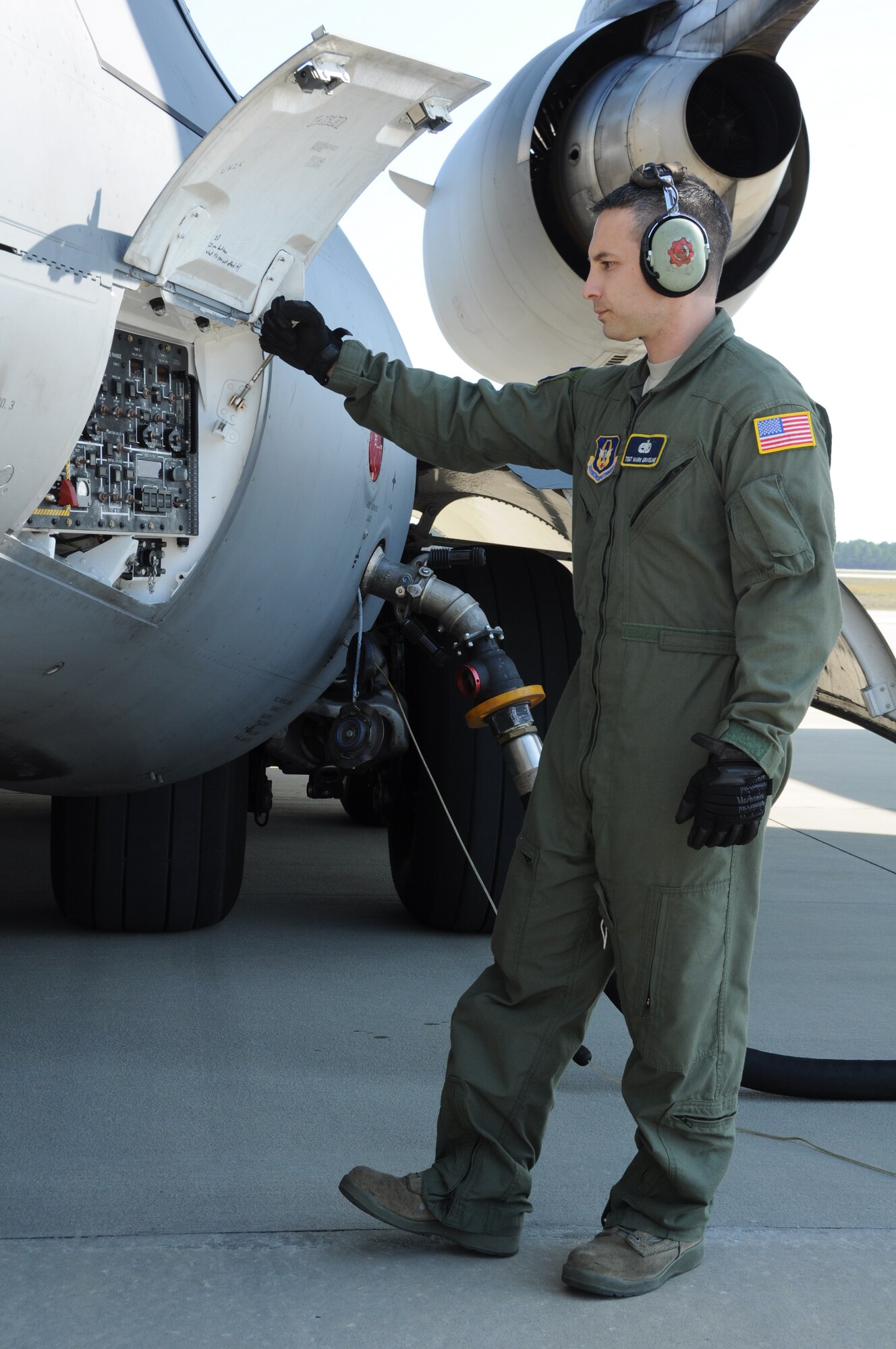 Tech. Sgt. Mark Graveline fuels a C-17 Globemaster III aircraft March 16, 2012 at Tyndall Air Force Base, Fla. During the mission, Sergeant Graveline helped deliver 50,000 lbs. of cargo, along with a combined team of 50 Airmen and contractors from the 325th Maintenance Group at TAFB, to Naval Air Station Key West, Fla. Sergeant Graveline is a flying crew chief with the 31th Aircraft Maintenance Squadron at Joint Base Charleston, S.C. (U.S. Air Force photo/Staff Sgt. Shane Ellis)