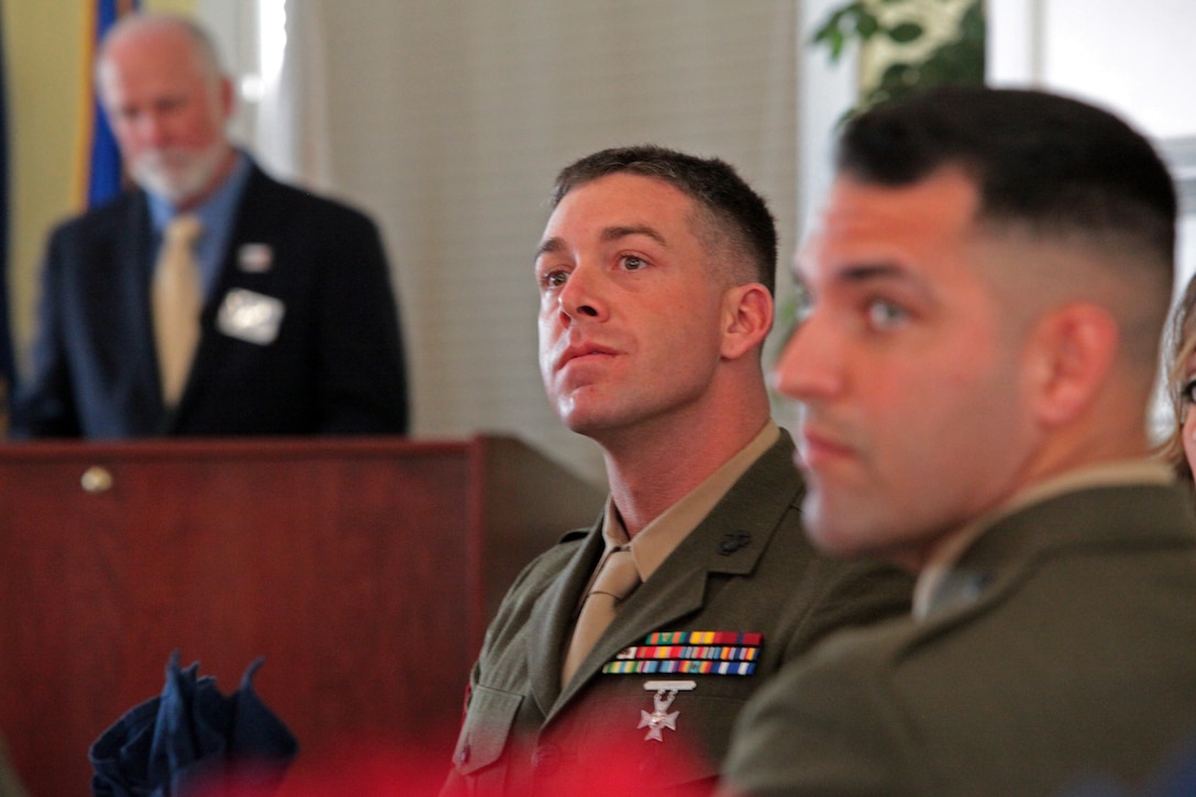 Sergeant John Margaritondo sits in attendance as the guest of honor to be awarded the Marine of the Month award by the Jacksonville-Onslow Military Affairs Committee March 19.