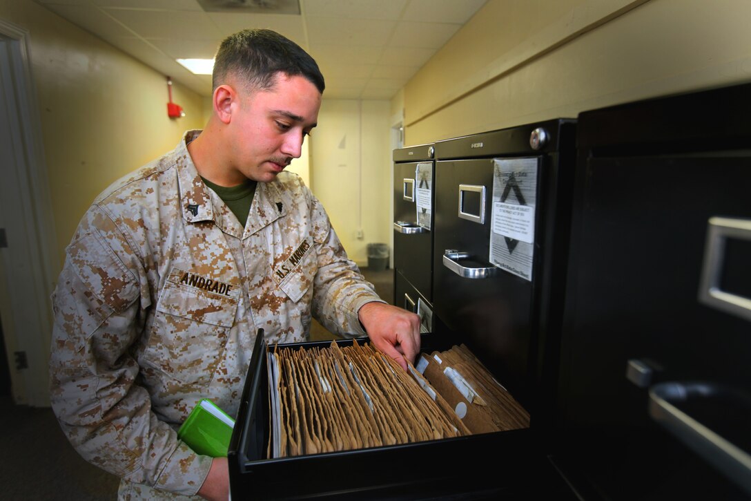 Cpl. Joshua Andrade, an administrative specialist with Marine Corps Air Station Cherry Point Installation Personnel Administration Center, reviews what is left of the Cherry Point service record books, March 19, 2012. Cherry Point IPAC transferred over 9,000 record books to electronic data that is now accesible on Marine Online, http://www.mol.usmc.mil.