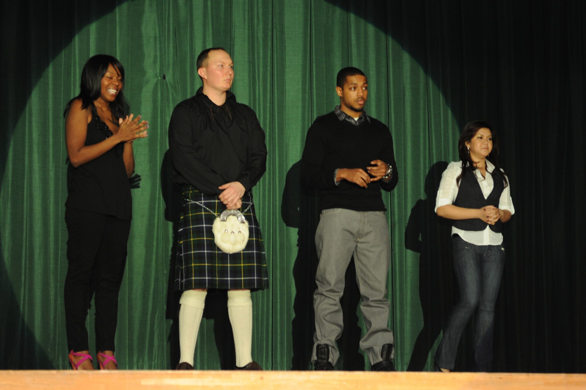 From left, Marcie Nichter, Charles Johnson, Carey Chisolm, and Nereza Lam, Misawa Solo Star contestants, await the results of the Misawa Solo Star singing competition finale at Misawa Air Base, Japan, March 17, 2012. Nereza Lam won the prize of $1,000. (U.S. Air Force photo by Airman 1st Class Kia Atkins/Released)
