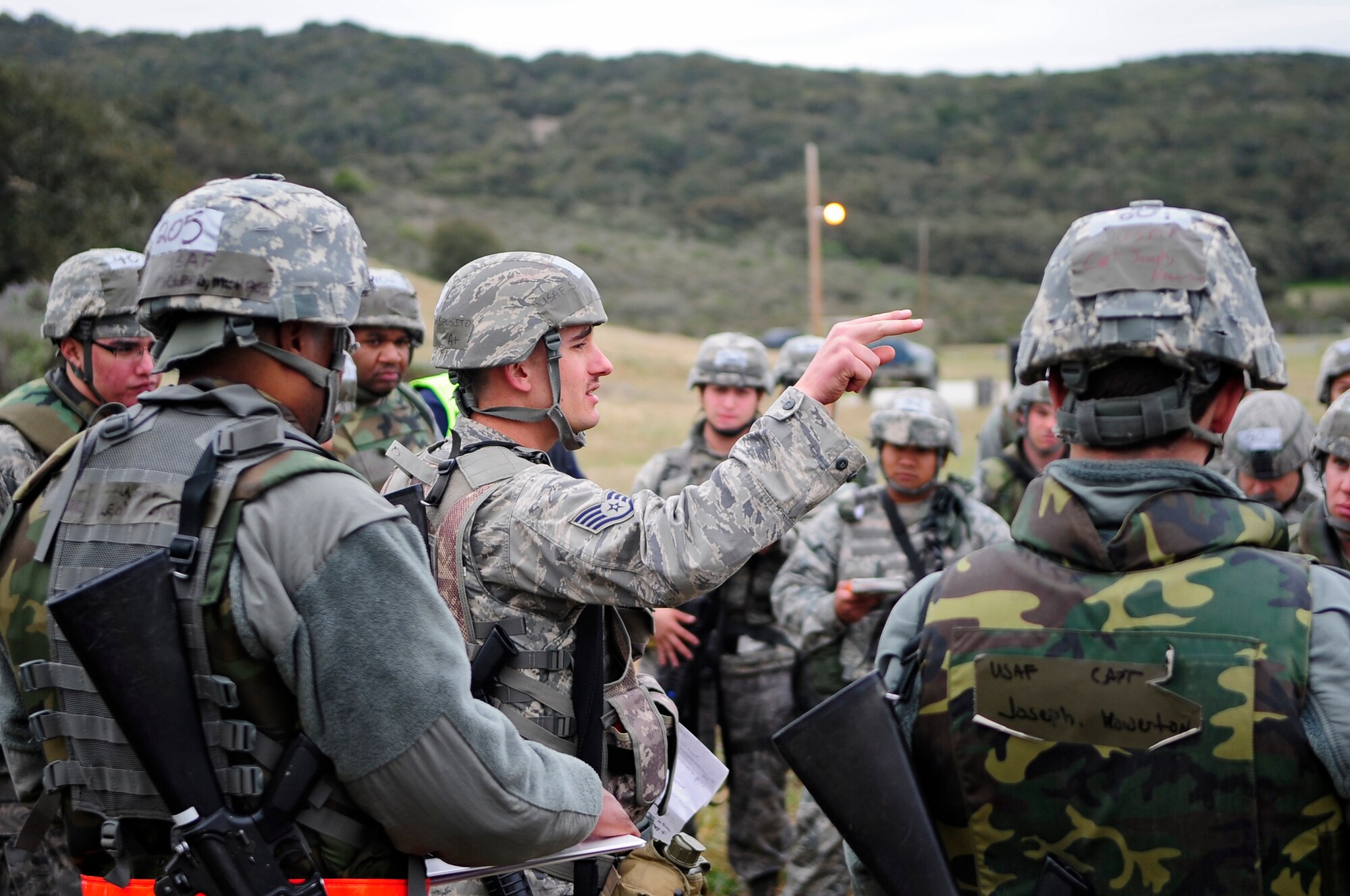 VANDENBERG AIR FORCE BASE, Calif. -- Staff Sgt. Alfred Esposito, 30th Civil Engineer Squadron Readiness Flight member, briefs Team V members at the start of the Northstar exercise here Thursday, March 15, 2012. The Northstar exercise tests the deployment capabilities and combat readiness skills for Vandenberg Airmen. (U.S. Air Force photo/Michael Peterson)