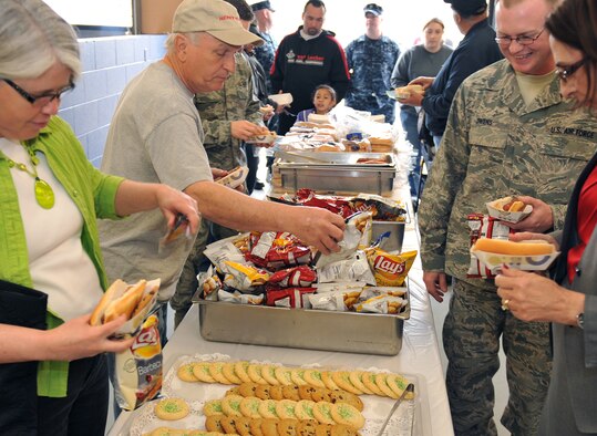 Patrons were treated to hot dogs, chips and snacks to celebrate the grand opening of the Outdoor Rec/Auto Hobby facility on Offutt Air Force Base, Neb., March 15. U.S. Air Force Brig Gen. Donald Bacon, 55th Wing commander Offutt Air Force participated in the official ribbon cutting and was escorted throughout the building for a personal tour. A bounce house, dunk tank and prizes were given out to celebrate the event. (Photo by Jeff Gates/Released)