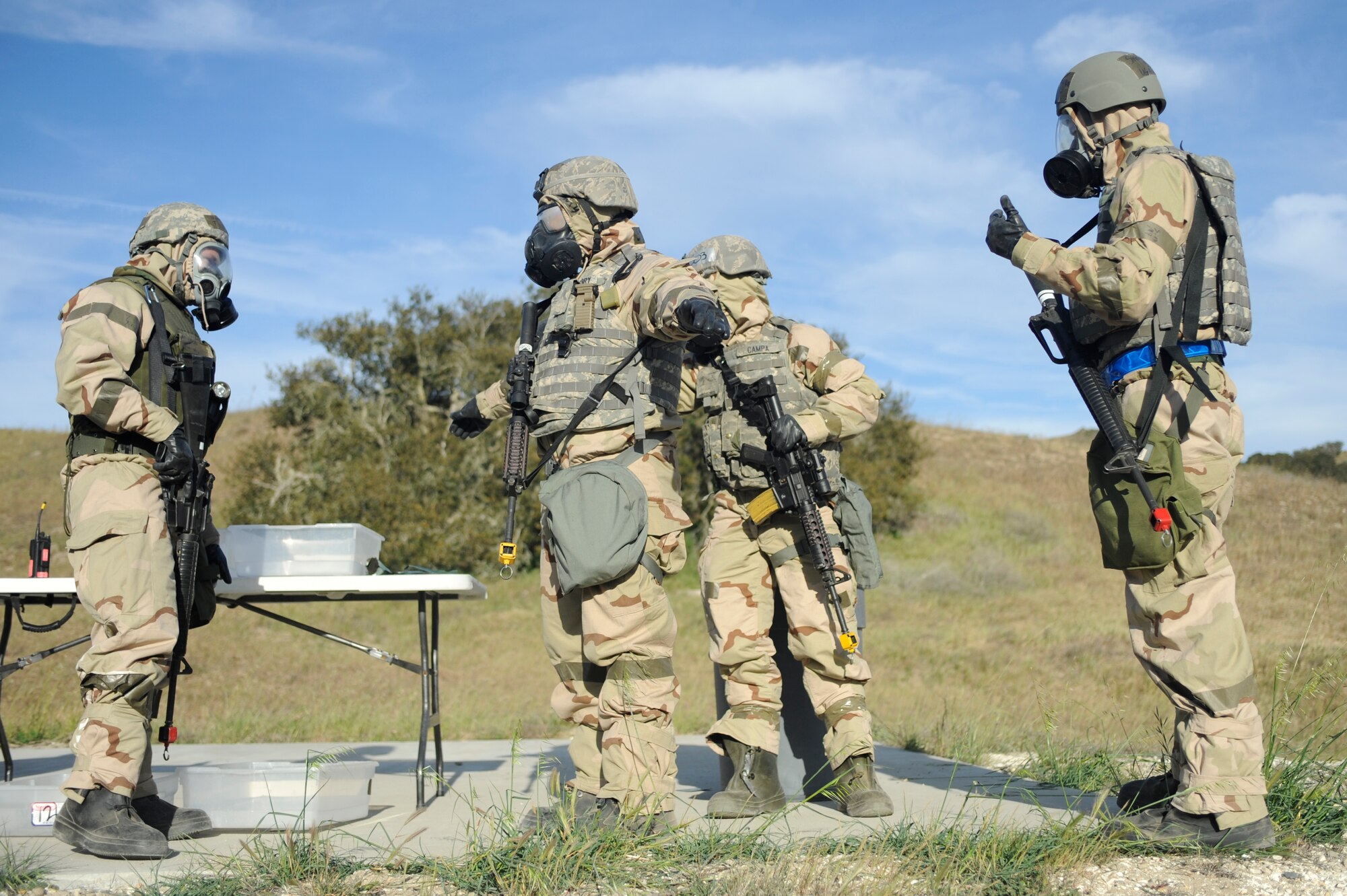 VANDENBERG AIR FORCE BASE, Calif. -- Airmen from the 30th Civil Engineer Squadron observe a contamination cleaning during the Northstar exercise training here Thursday, March 15, 2012. The Northstar exercise tests the deployment capabilities and combat readiness skills for Airmen. (U.S. Air Force photo/Staff Sgt. Andrew Satran) 

 