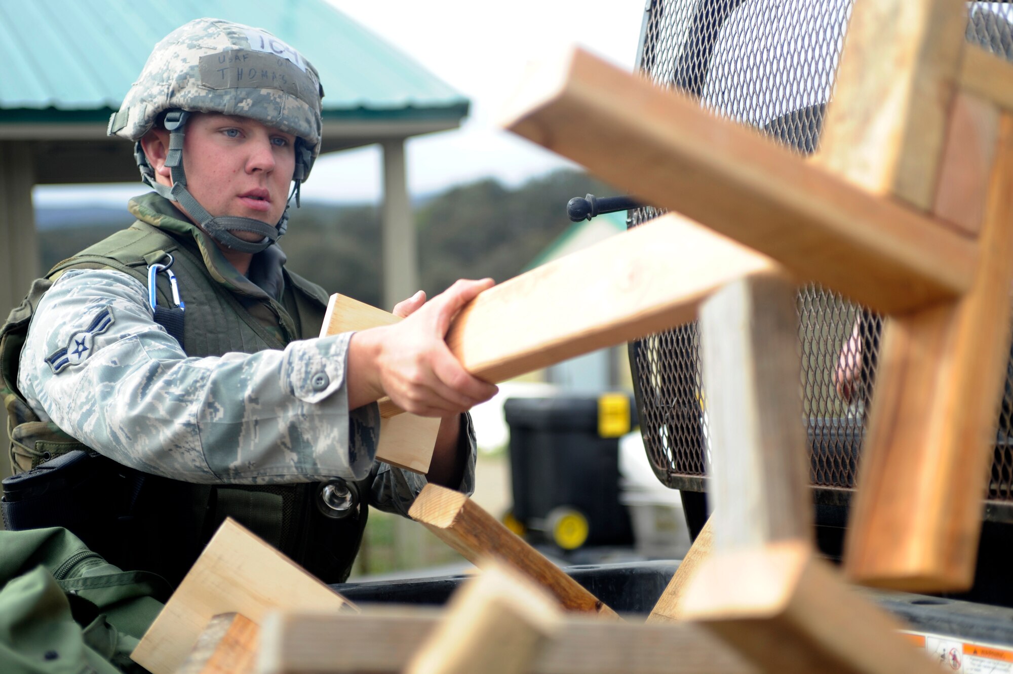VANDENBERG AIR FORCE BASE, Calif. -- Airman 1st Class Thomas Shea, 30th Civil Engineer Squadron member, stacks wooden stations during the Northstar exercise training here Thursday, March 15, 2012. The Northstar exercise tests the deployment capabilities and combat readiness skills for Airmen. (U.S. Air Force photo/Staff Sgt. Andrew Satran) 

 