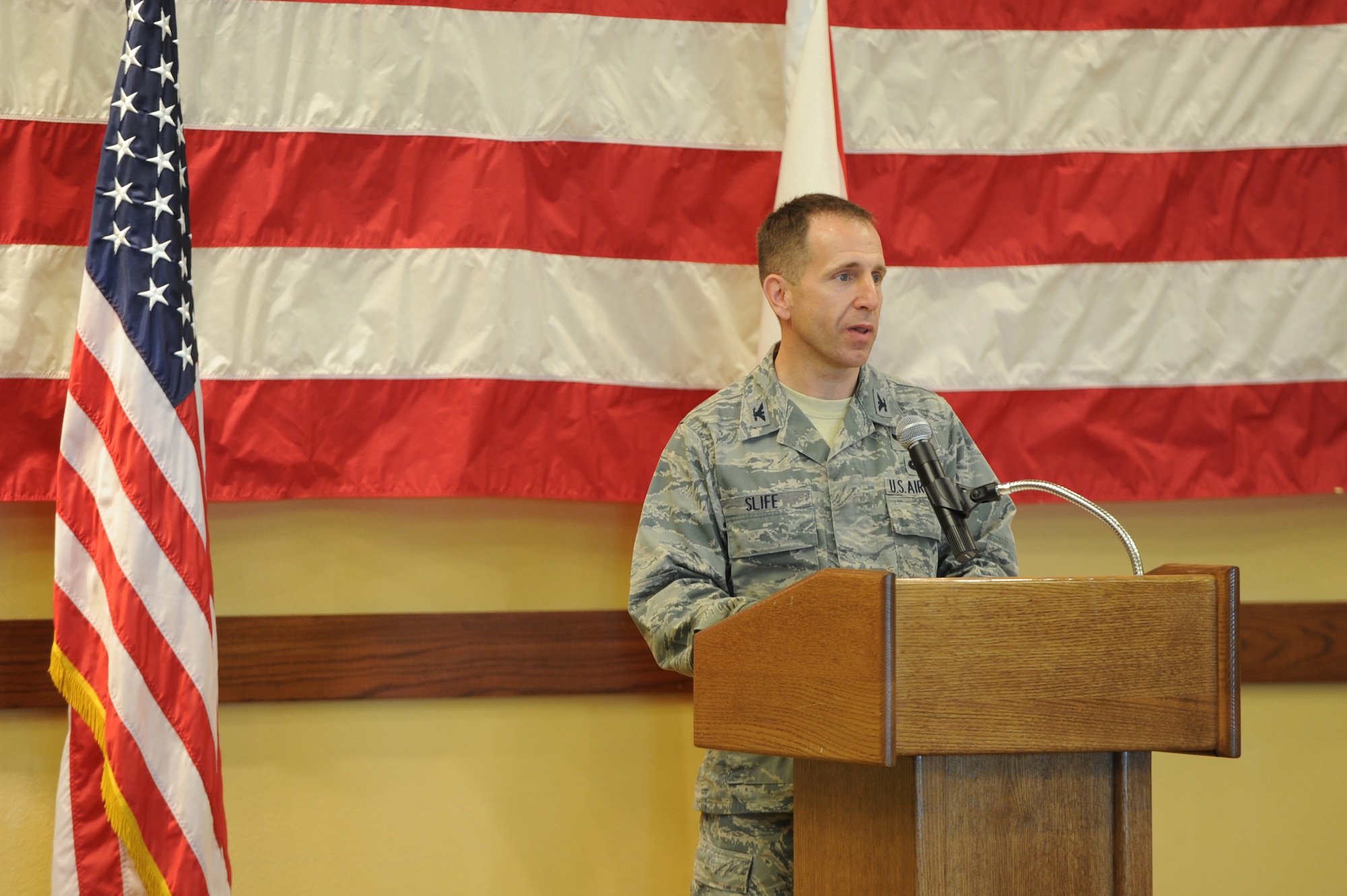 Col. Jim Slife, commander of the 1st Special Operations Wing, speaks at a press conference at the Soundside Club on Hurlburt Field, Fla., March 15, 2012. State leadership also participated in the conference to announce a $21.2 million project to build a fly-over bridge outside Hurlburt Field's main gate. (U.S. Air Force photo/Senior Airman Eboni Reams)(Released)
