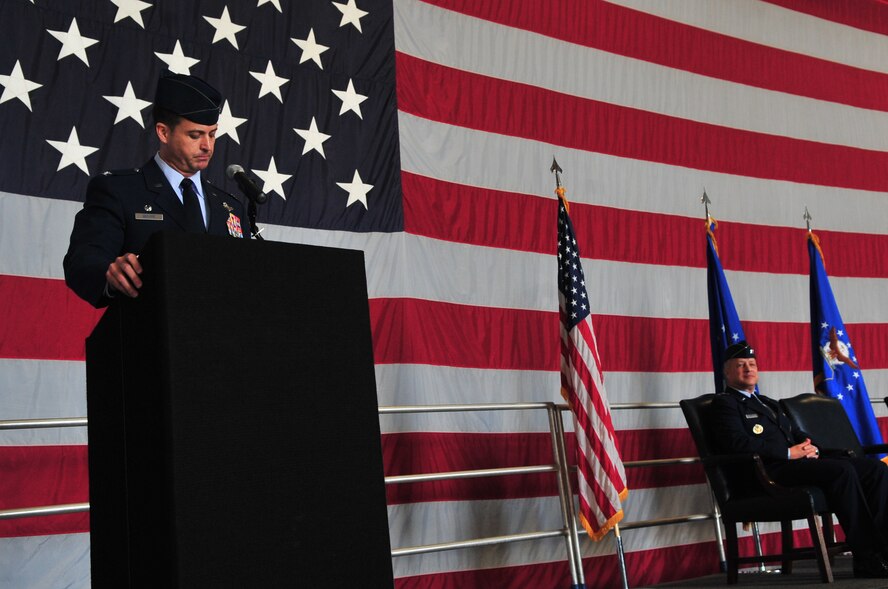U.S. Air Force Col. Charles Moore, former 20th Fighter Wing commander, speaks during the change of command ceremony for the new wing commander Col. Clay Hall, Shaw Air Force Base, S.C., March 19, 2012. The new commander will lead the Air Force's largest F-16 combat wing in its mission to maintain readiness to deploy and employ combat forces in support of operational wartime requirements worldwide. (U.S. Air Force photo by Airman 1st Class Ashley L. Gardner/ Released)