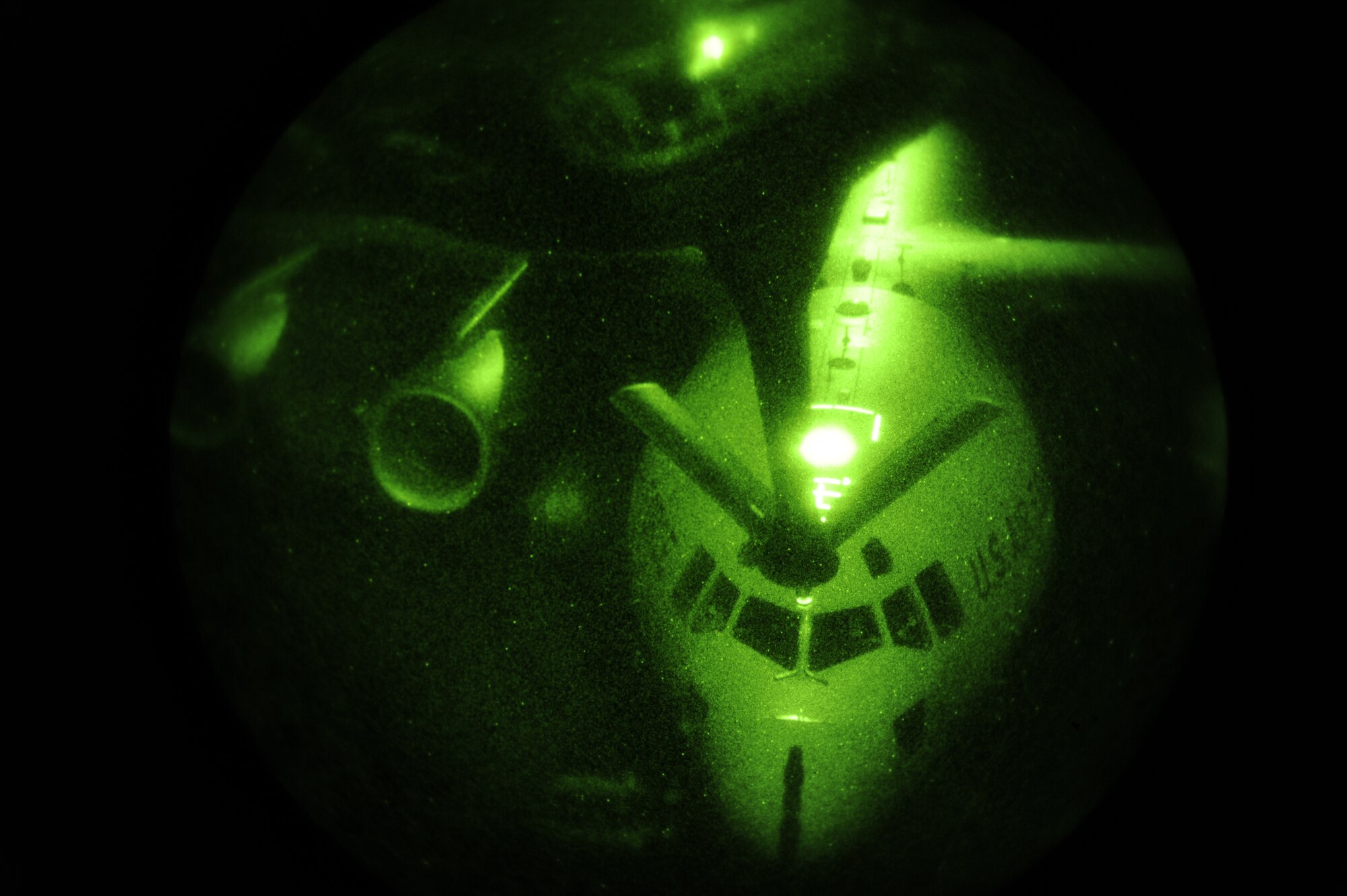 A C-17 Globemaster III is refueled by a KC-135 Stratotanker, which is flown and operated by pilots and air crew from McConnell Air Force Base. The night refueling took place approximately 30,000 feet in the air, over the coast of Washington. (U.S. Air Force photo by Airman 1st Class Earlandez Young) 