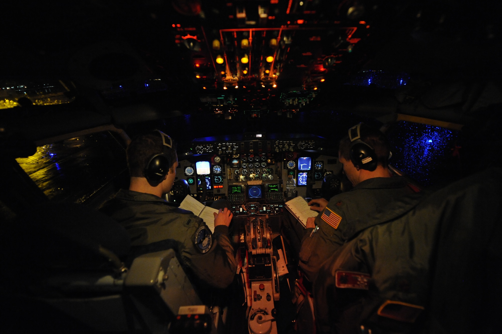 McConnell Air Force Base pilots, 1st Lt. Matthew Welch, 334th Air Refueling Squadron, and Maj. Shane Rogers, 22nd Operations Group, sit inside the cockpit of a KC-135 Stratotanker on the runway at Fairchild Air Force Base, Wash., March 15, 2012 as they perform a pre-flight checklist before takeoff. (U.S. Air Force photo by Airman 1st Class Earlandez Young) 