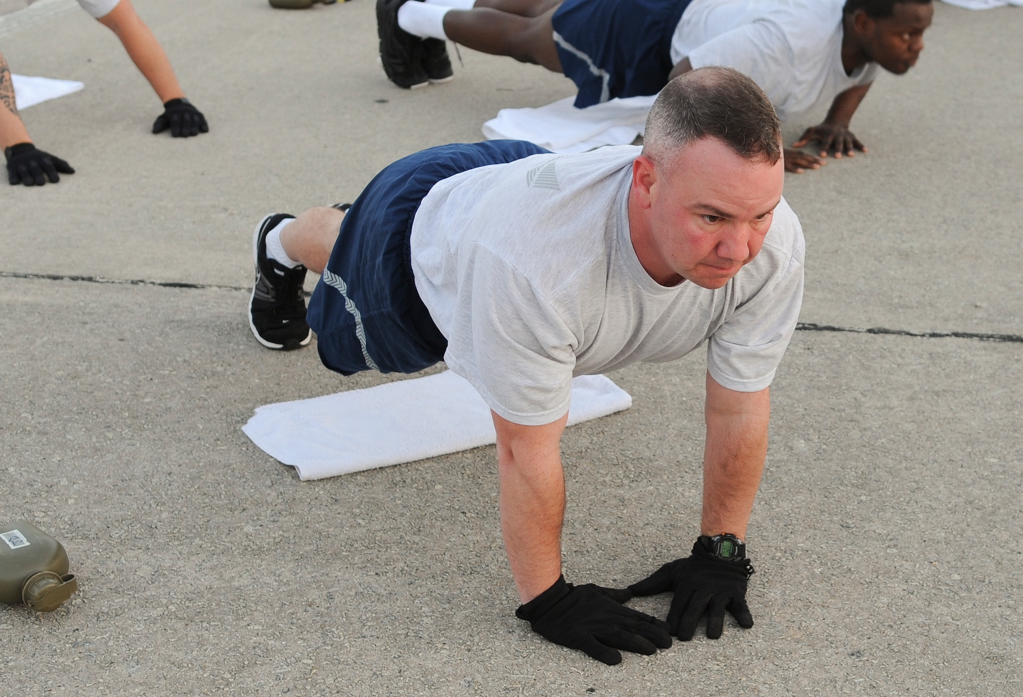 U.S. Air Force Tech. Sgt. Jeremy Dumas, 822th Base Defense Squadron, performs diamond push-ups during “Sergeant Rock” physical training at Moody Air Force Base Ga., March 16, 2012. This program was developed to improve individual physical strength as well as mental toughness. (U.S. Air Force photo by Airman 1st Class Olivia Dominique/Released)