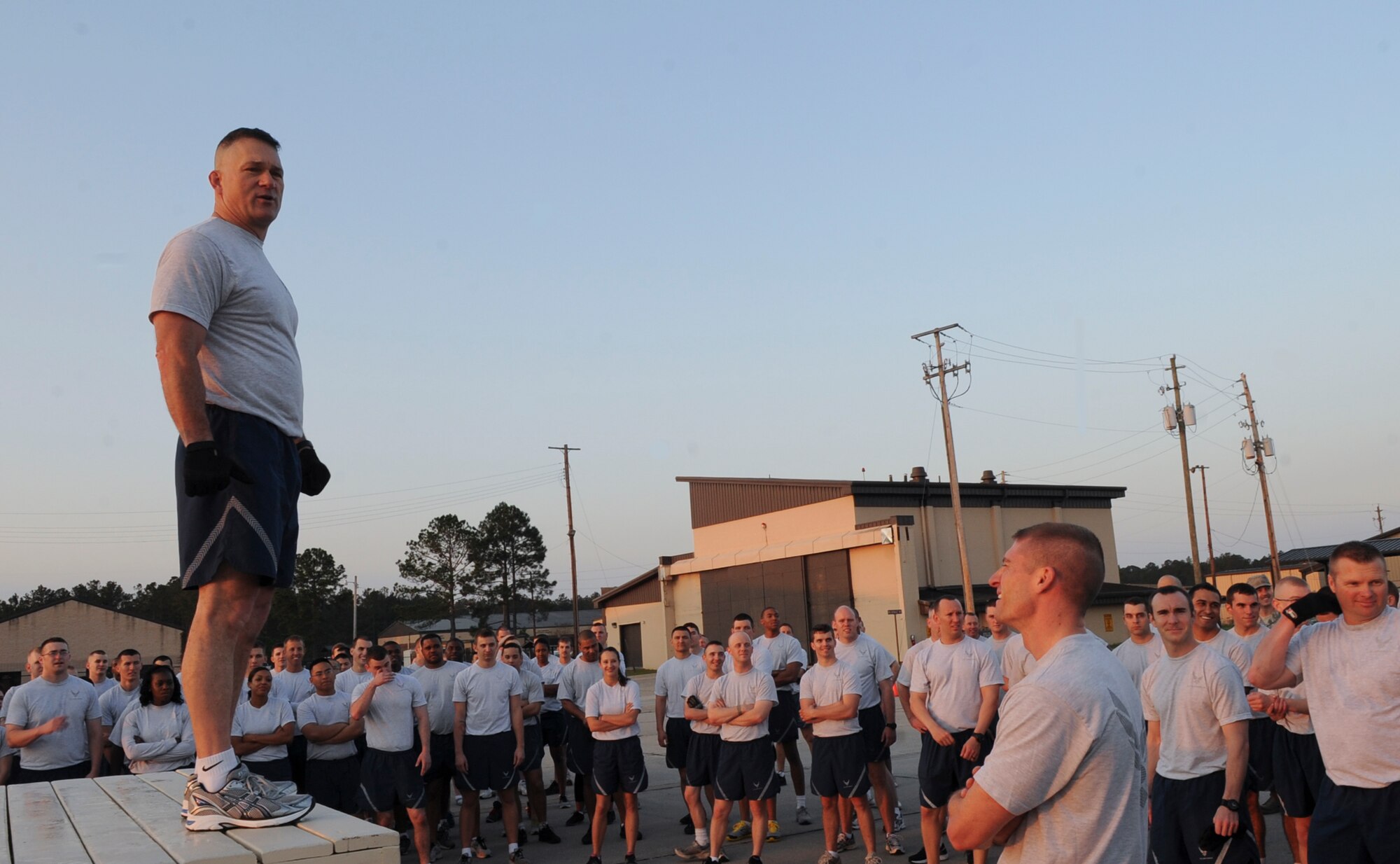 U.S. Air Force Col. Randall Richert, 820th Base Defense Group commander, encourages 820th BDG members during “Sergeant Rock” physical training at Moody Air Force Base, Ga., March 16, 2012. Richert explained the importance of being both mentally and physically motivated to exceed goals. (U.S. Air Force photo by Olivia Dominique/Released)