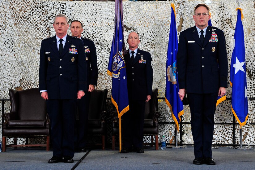 From left, Lt. Gen. Mark Ramsay, 18th Air Force commander, Maj. Gen. William Bender, U.S. Air Force Expeditionary Center commander, Chief Master Sgt. Earl Hannon, former 21st Expeditionary Mobility Task Force command chief, and Brig. Gen. Scott Goodwin, former 21st EMTF commander, listen as the official order inactivating the 21st EMTF is announced during a ceremony at Joint Base McGuire-Dix-Lakehurst’s Global Reach Deployment Center March 19. The inactivation of the 21st EMTF and administrative transfer of the its subordinate units, the 621st Contingency Response Wing and the 521st Air Mobility Operations Wing, to the EC is part of an Air Mobility Command restructuring initiative. (U.S. Air Force photo by Tech. Sgt. Parker Gyokeres/released)
