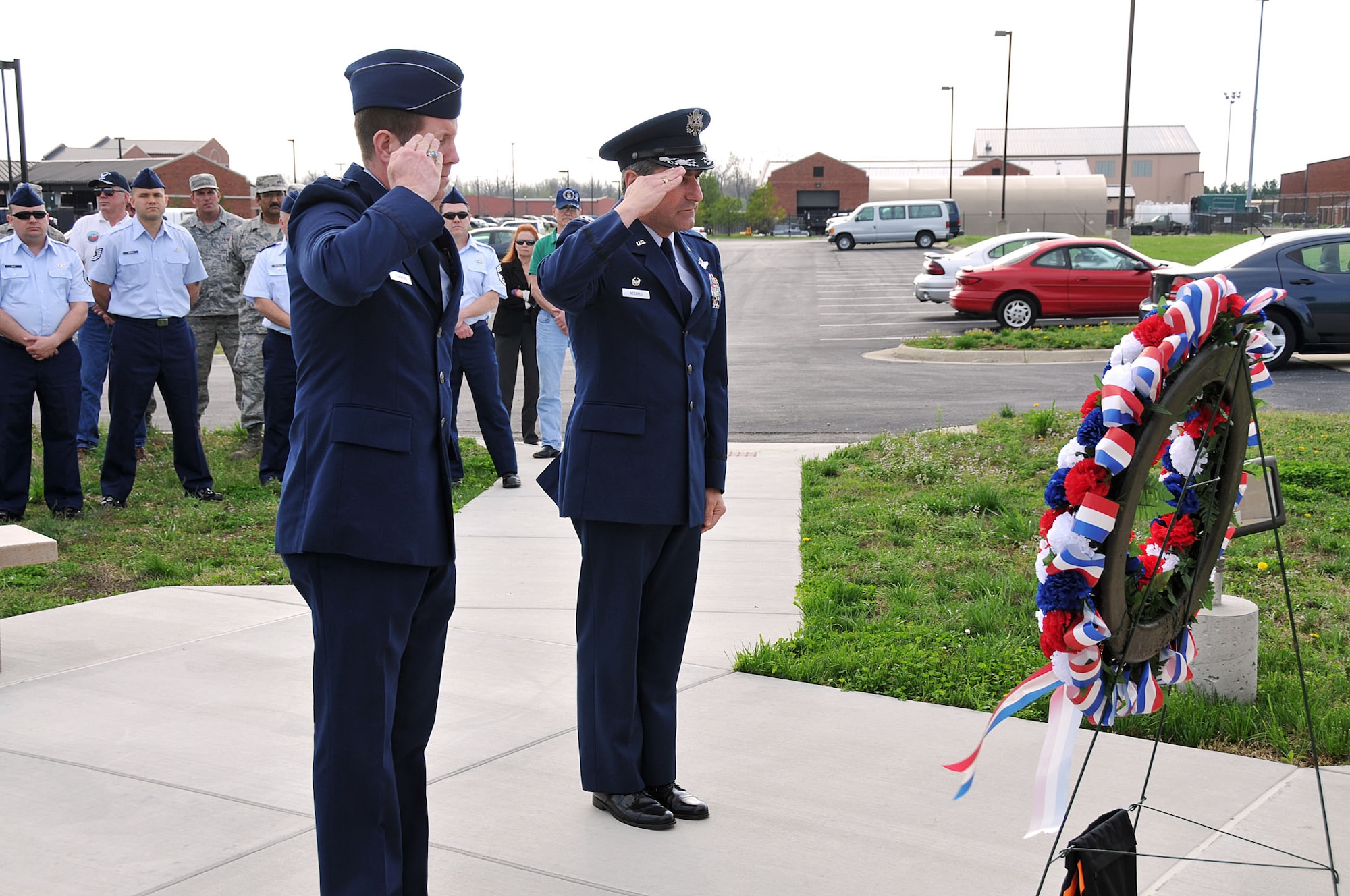 Col. Pete Nezamis (right), Commander, 126th Air Refueling Wing, and Lt. Col. Leslie Summers, a chaplain assigned to the 126th Air Refueling Wing, render a respectful salute in front of a memorial at Scott AFB, Ill on March 19, 2012. A ceremony was held to commemorate the four Wing aircrew members who perished in an aircraft accident 30 years ago. Maj. William S. Dixon, Jr., Capt. Kenneth L. Herrick, Capt. Robert J. Nicosia and Master Sgt. Richard A. Crome were aboard a Illinois National Guard KC-135A Stratotanker while on a routine training mission when their plane exploded near Greenwood, Ill. In addition, 23 members of the 928th Tactical Airlift Group, Air Force Reserves, who were passengers also lost their lives. (National Guard photo by Master Sgt. Ken Stephens)