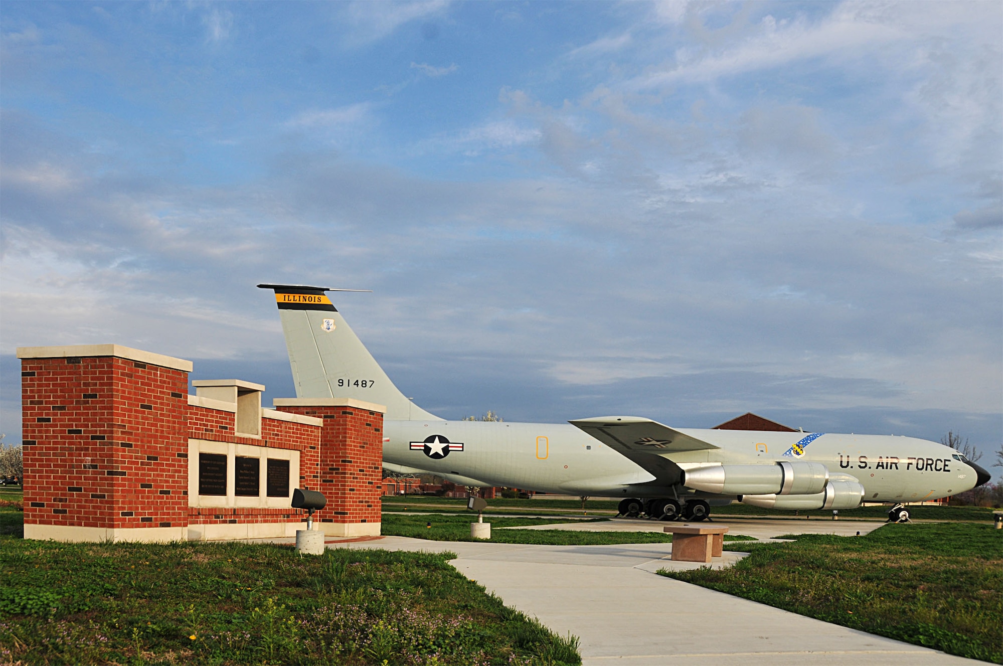 The early morning sun lights up a memorial dedicated to the four 126th Air Refueling Wing aircrew members who perished in an aircraft accident 30 years ago. Maj. William S. Dixon, Jr., Capt. Kenneth L. Herrick, Capt. Robert J. Nicosia and Master Sgt. Richard A. Crome were aboard a Illinois National Guard KC-135A "Stratotanker" while on a routine training mission when their plane exploded near Greenwood, Ill., on March 19, 1982. In addition, 23 members of the 928th Tactical Airlift Group, Air Force Reserves, who were passengers also lost their lives. The 126th Air Refueling Wing, located at Scott AFB, Ill., held a memorial ceremony to commemorate the anniversary of the accident. The static display aircraft in the background is a more recent version of the "Stratotanker", the KC-135E. (National Guard photo by Master Sgt. Ken Stephens)