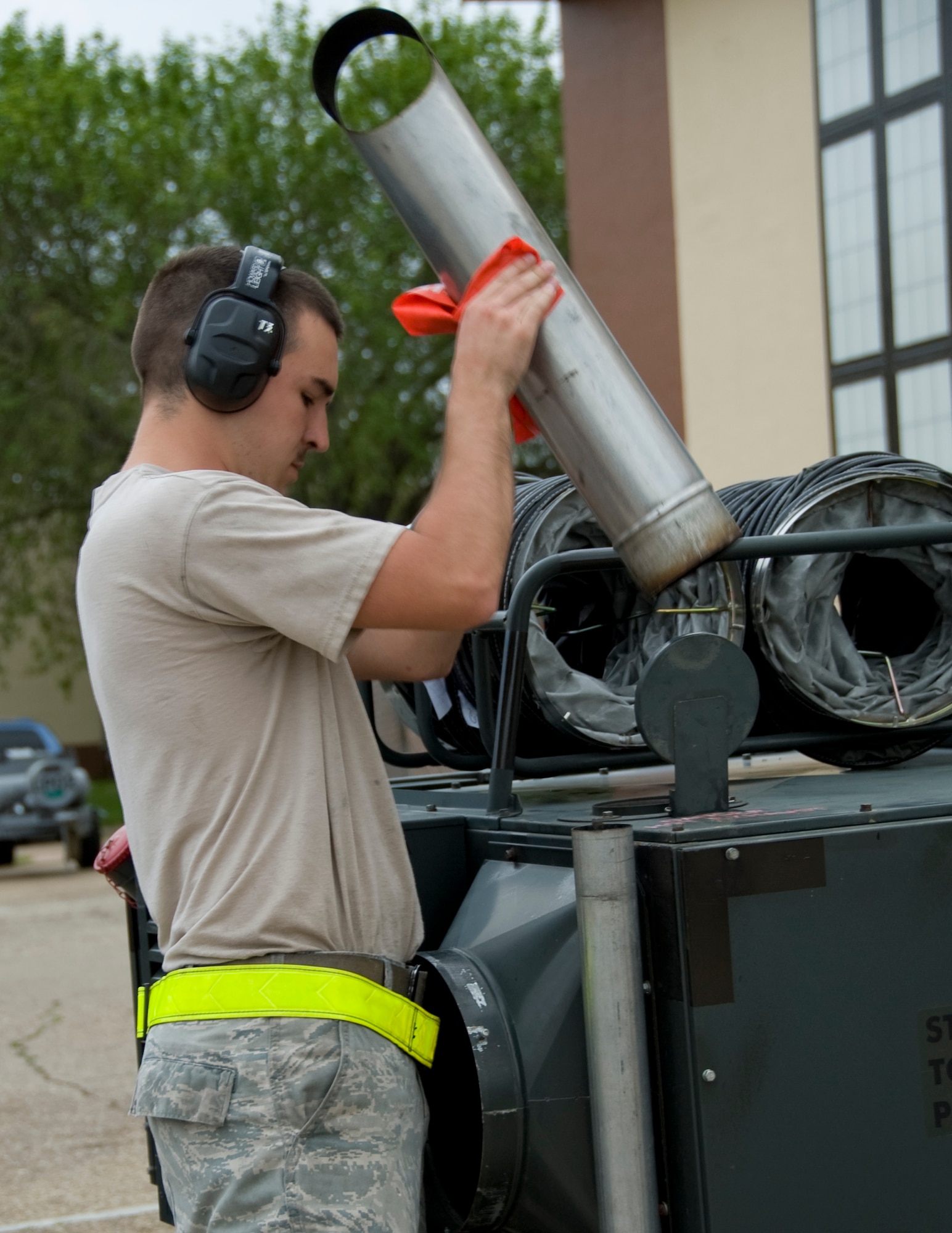 Senior Airman Jimmy Ashburn, 2nd Maintenance Squadron Aerospace Ground Equipment flight, removes an air duct from a new generation heater after conducting an operations check on Barksdale Air Force Base, La., March 19. During the operations check, AGE Airmen ensure the heater is operational by checking for carbon monoxide emissions and smoke from the exhaust. (U.S. Air Force photo/Airman 1st Class Benjamin Gonsier)(RELEASED)