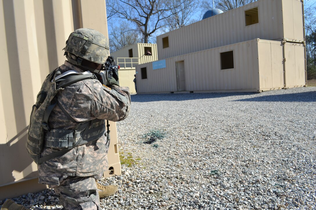 U.S. Army Spc. Darius Williams of 368th Seaport Operations Company takes aim while training at the Fort Eustis Military Operations on Urban Terrain site on March 14. The training was part of Operation Winter Squall, a mini logistics-over-the-shore exercise, which took place March 10-16 at Fort Eustis and Joint Expeditionary Base Little Creek-Fort Story.   (Photo by 1Lt Andrea Whitaker)