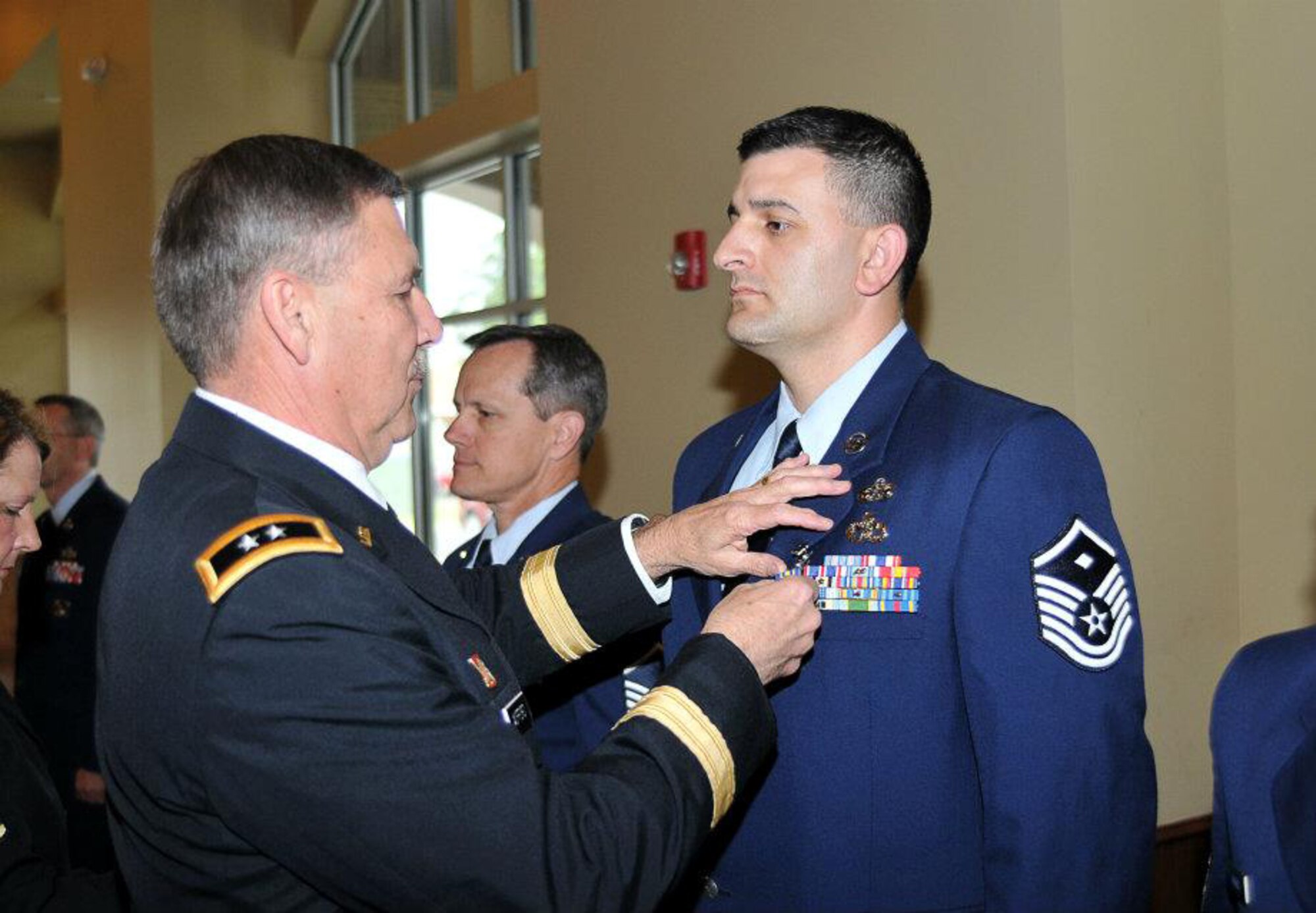 Master Sgt. Joshua Rich of the 188th Fighter Wing was named Arkansas Air National Guard First Sergeant of the Year. Maj. Gen. William Wofford, the adjutant general of the Arkansas National Guard, presents Rich with an Arkansas Distinguished Service Medal. (Photo by Arkansas National Guard Public Affairs)