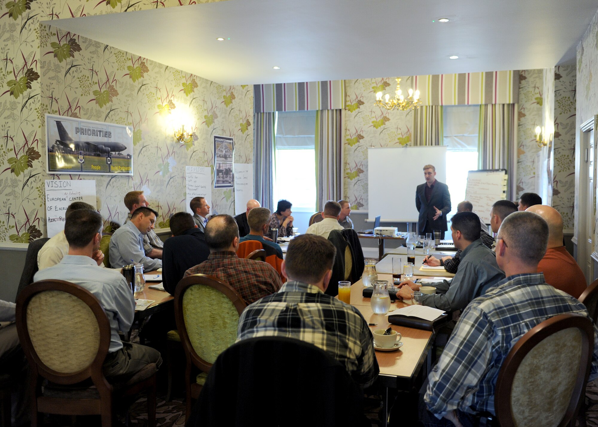 Tech. Sgt. Ronald Cooney, 100th Air Refueling Wing Air Force Smart Operations for the 21st Century, leads discussions with leadership from across the 100th ARW March 15, 2012, as they assess their strategic alignment and development plan, a practice used in the military, civilian industry and corporate world to establish overarching themes and goals. Over the course of the year, the objectives will be used to gauge whether the wing mission is being successfully accomplished. (U.S. Air Force photo/Tech. Sgt. Neal X. Joiner) 