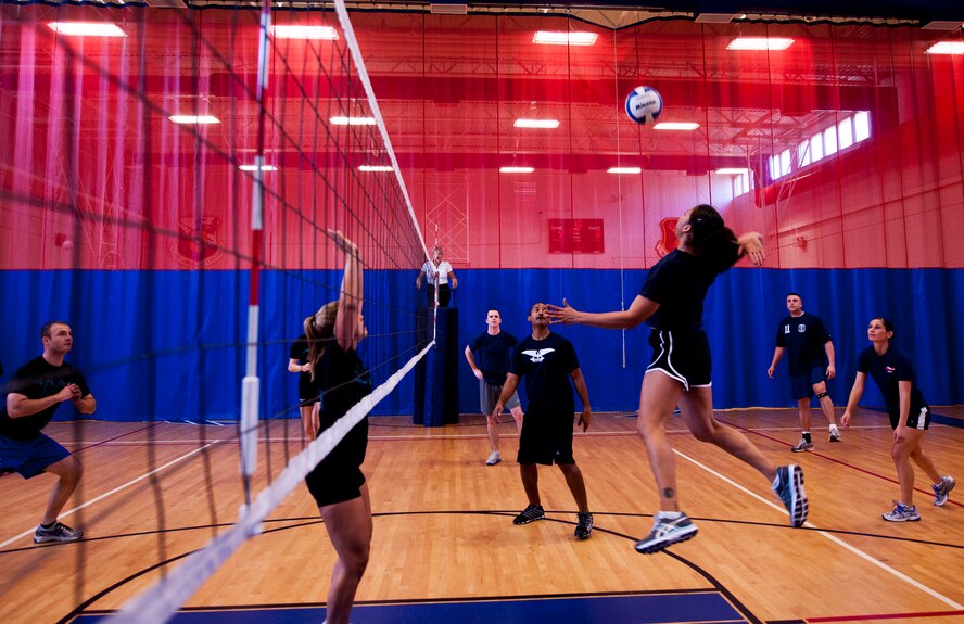 An NCO goes up for a spike during the 5/6 NCO Council versus Company Grade Officers Council volleyball game March 16 at Eglin Air Force Base, Fla.  The CGOC took the win in the first of three volleyball games pitting officers and enlisted Airmen.  The officers swept all three games with the Commanders and the Eagles also winning.  (U.S. Air Force photo/Samuel King Jr.)