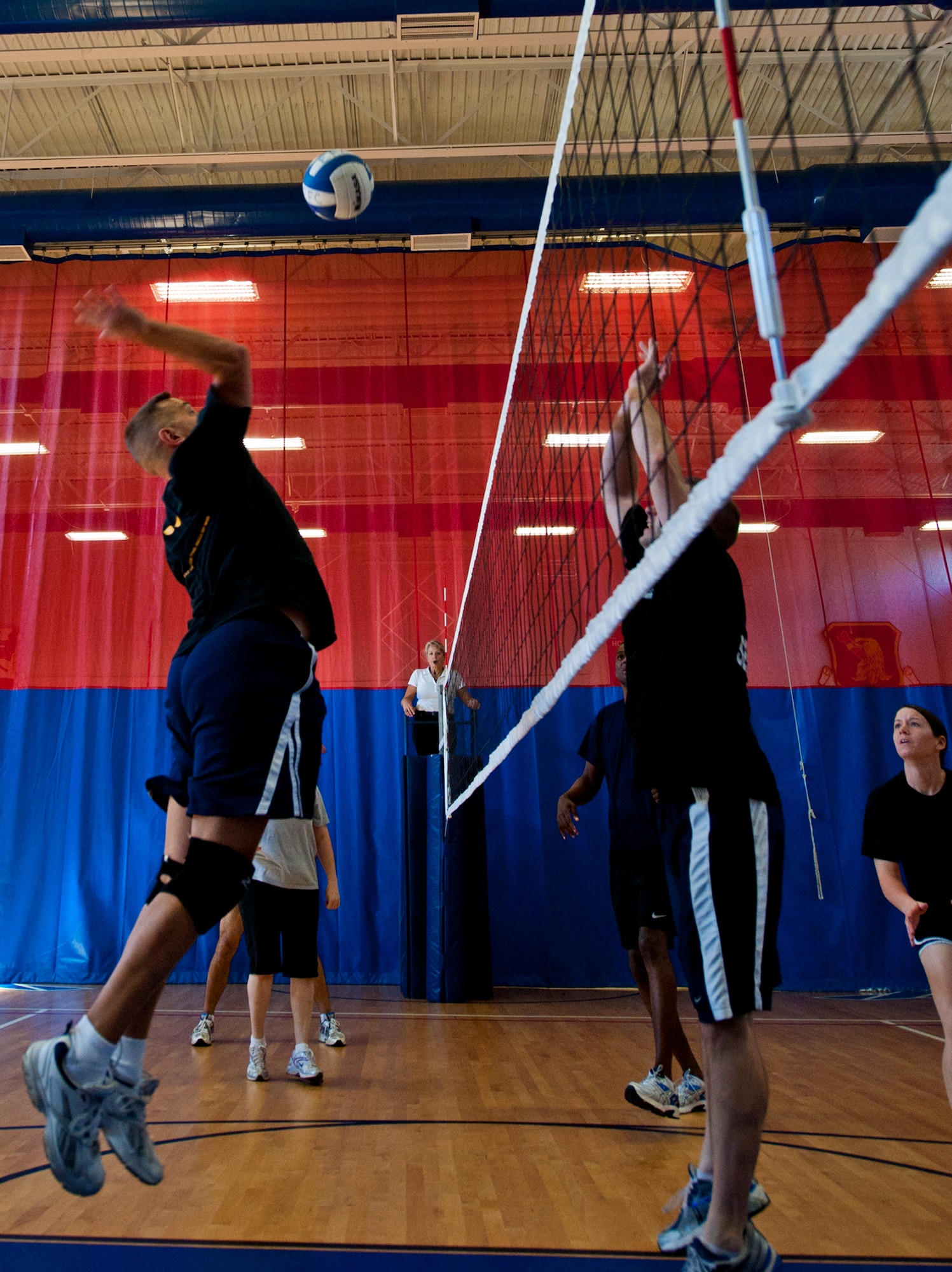 A commander goes up for a spike during the commanders versus first sergeants volleyball game March 16 at Eglin Air Force Base, Fla.  The commanders took the win in the closest of three volleyball games pitting officers and enlisted Airmen.  The officers swept all three games with the Company Grade Officers Council and the Eagles also winning.  (U.S. Air Force photo/Samuel King Jr.)
