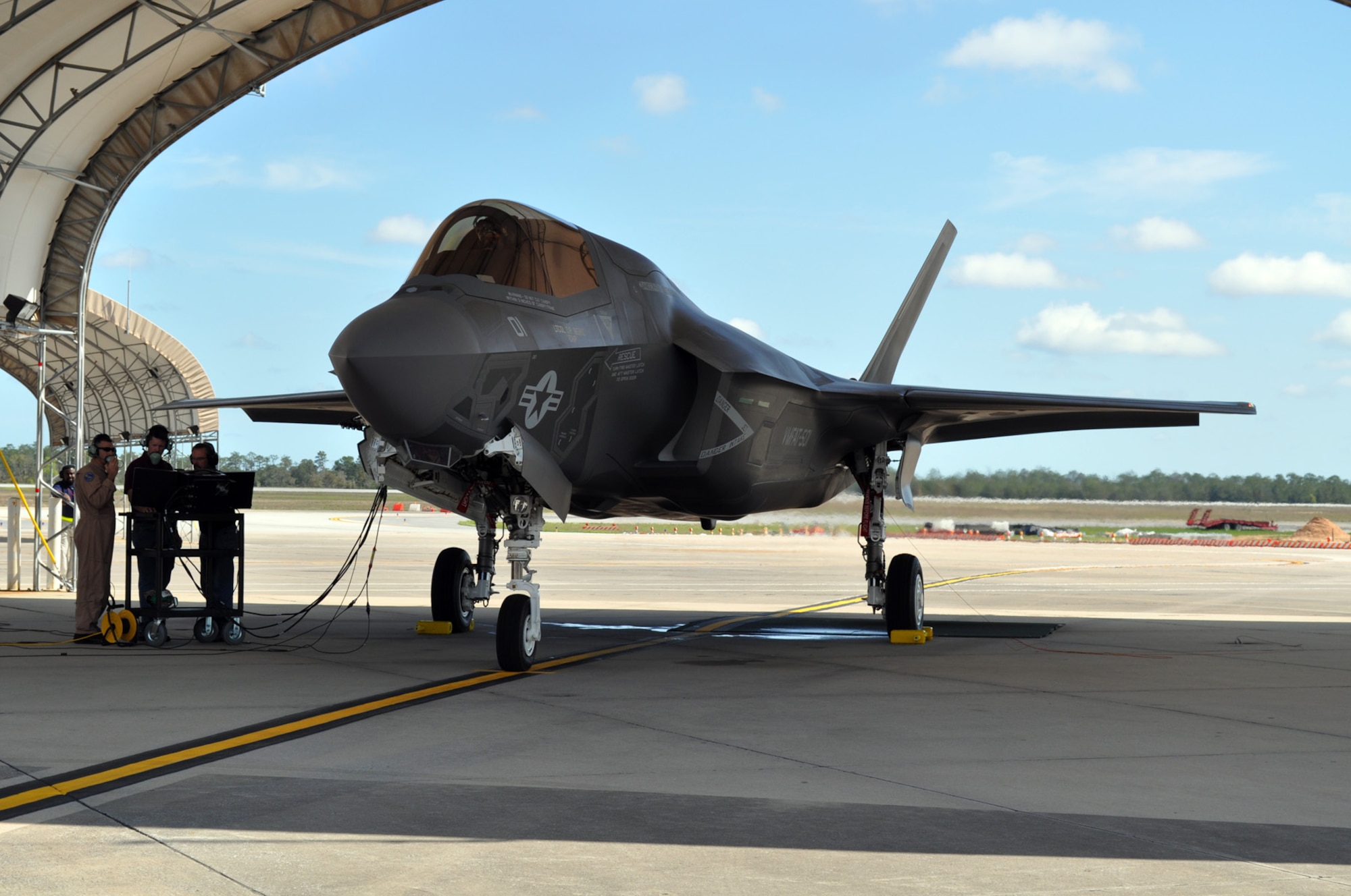 EGLIN AIR FORCE BASE, Fla. -- Marine Corps Maj. Aric Liberman, operations officer, Marine Fighter Attack Squadron 501 at the 33rd Fighter Wing, Eglin AFB, Fla., trains with Lockheed Martin contracted logistics maintenance personnel during the first engine run of the F-35B, March 14. The F-35B is the Marine Corps variant of the Joint Strike Fighter. (U.S. Air Force photo/Maj. Karen Roganov)