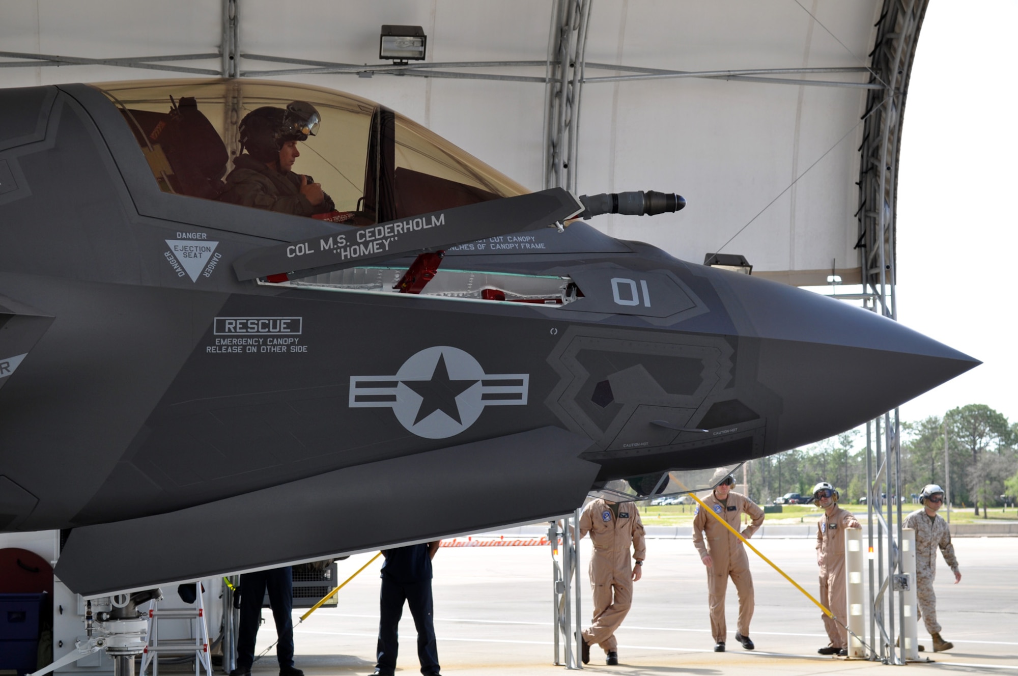 EGLIN AIR FORCE BASE, Fla. -- Marine Corps pilot Maj. Joseph Bachmann, Marine Fighter Attack Squadron 501 at the 33rd Fighter Wing at Elgin AFB, Fla., operates aircraft systems in conjunction with the plane captain, known as a crew chief in the Air Force, and other maintenance personnel to monitor the joint strike fighter's health during the first engine run of the F-35B March 14. The VMFAT-501 cadre will conduct engine familiarization and taxi runs later this month. (U.S. Air Force photo/Maj. Karen Roganov)
