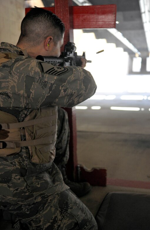 Master Sgt. Anthony Baeza, 70th Intelligence Surveillance and Reconnaissance Wing NCO in charge, takes aim at down-range targets at the Combat Arms Training and Maintenance (CATM) facility Feb. 14. (U.S. Air Force photo/Airman 1st Class Lindsey A. Beadle)
