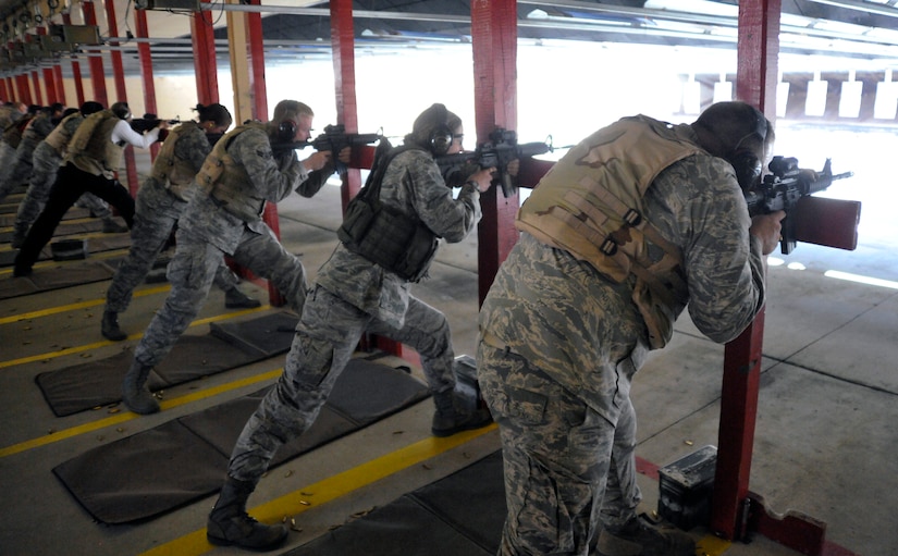 Combat Arms Training and Maintenance (CATM) refresher-course students take aim at targets down range Feb. 14. While shooting, CATM students utilize numerous Defensive Fighting Positions during their one-day refresher course. (U.S. Air Force photo/Airman 1st Class Lindsey A. Beadle)