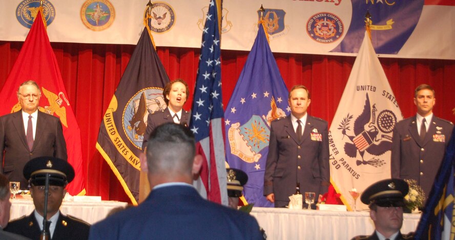 Maj. Erin Karl, 916th Public Affairs Office, sings the national anthem at the 2012 Annual Employer Recognition Banquet in Greensboro on March 17, 2012. The 916th ARW co-hosted the event with the 440th AW and the NC ESGR committee.  (USAF photo by Maj. Shannon Mann, 916ARW/PA)