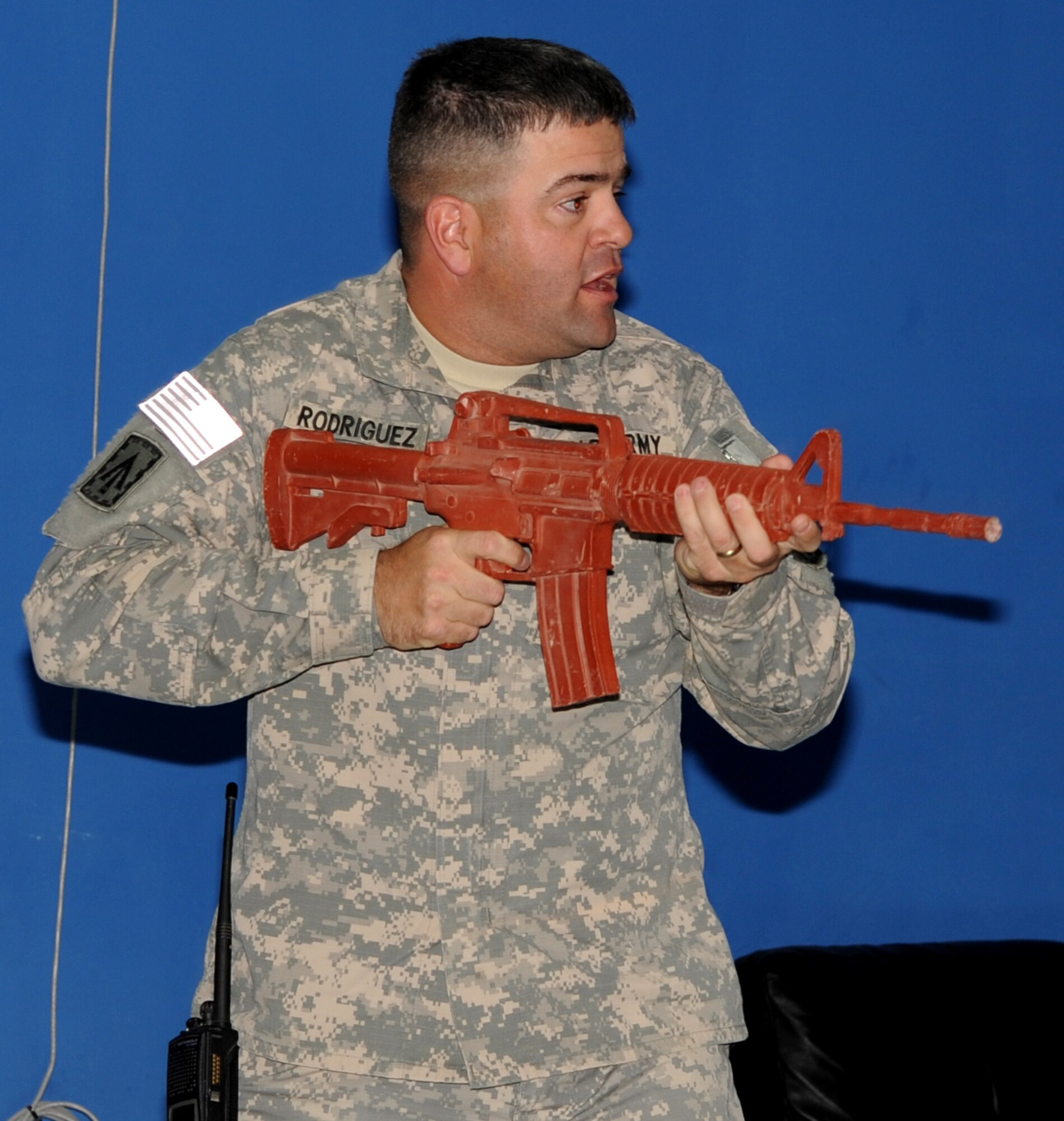 SOUTHWEST ASIA - Army Master Sgt. Lee Rodriguez portrays a gunman during an exercise at the 380th Air Expeditionary Wing  March 16, 2012. The exercise tested the abilities of people deployed here to respond in case of an active shooter on the installation. (U.S. Air Force photo/Tech. Sgt. Arian Nead)