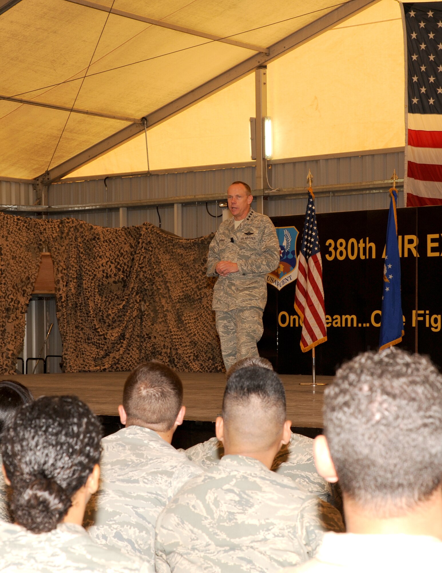 SOUTHWEST ASIA - Gen. Donald Hoffman address the concerns that many Airmen from the 380th Air Expeditionary Wing have about the future of the wing as well as the Air Force as a whole at an all-call March 18, 2012. The commander of Air Force Materiel Command spent two days with service members deployed to the 380th AEW. During the visit, he and members of his staff met with Airmen throughout the wing, particularly logistics and maintenance work centers, to get first-hand feedback about their challenges. (U.S. Air Force photo/Tech. Sgt. Arian Nead)  
