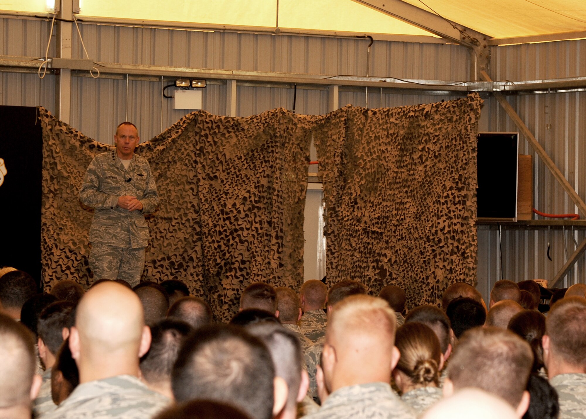 SOUTHWEST ASIA - Gen. Donald Hoffman address the concerns that many Airmen from the 380th Air Expeditionary Wing have about the future of the wing as well as the Air Force as a whole at an all-call March 18, 2012. The commander of Air Force Materiel Command spent two days with service members deployed to the 380th AEW. During the visit, he and members of his staff met with Airmen throughout the wing, particularly logistics and maintenance work centers, to get first-hand feedback about their challenges. (U.S. Air Force photo/Tech. Sgt. Arian Nead)  

