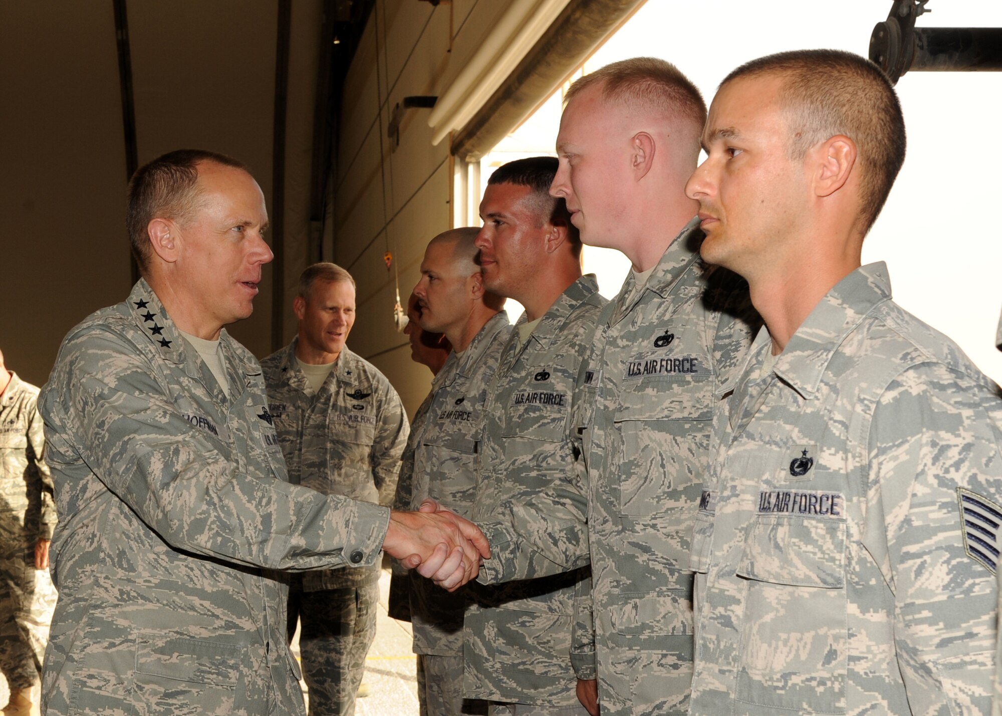 SOUTHWEST ASIA - Gen. Donald Hoffman shakes hands with Airmen from the 380th Expeditionary Aircraft Maintenance Squadron March 17, 2012.    The commander of Air Force Materiel Command spent two days with service members deployed to the 380th Air Expeditionary Wing. During the visit, he and members of his staff met with Airmen throughout the wing, particularly logistics and maintenance work centers, to get first-hand feedback about their challenges. (U.S. Air Force photo/Tech. Sgt. Arian Nead)  

