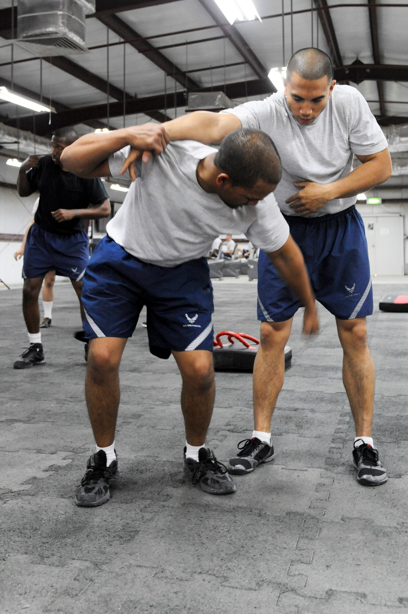 SOUTHWEST ASIA -- Airman 1st Class Rick Palomares, 332nd Expeditionary Security Forces Squadron member, strikes the A-frame of Tech. Sgt. Rolando Collantes, 332nd Expeditionary Maintenance Group member, during a Krav Maga class at an undisclosed location in Southwest Asia, March 14, 2012. The class taught Airmen self-defense techniques ranging from armed combative encounters to escaping from choke and strangle-holds. Palomeres is deployed from Mountain Home Air Force Base, Idaho. Collantes is deployed from Shaw Air Force Base, and is a native of Mystic, Conn.  (U.S. Air Force Photo by Staff Sgt. Joshua J. Garcia)
