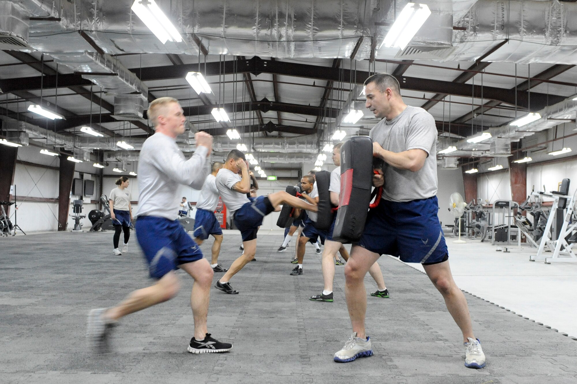SOUTHWEST ASIA -- Airmen from the 332nd Air Expeditionary Wing perform front kicks during a Krav Maga class at an undisclosed location in Southwest Asia, March 14, 2012. The class trained Airmen how to defend themselves and counter-attack assailants. (U.S. Air Force Photo by Staff Sgt. Joshua J. Garcia)