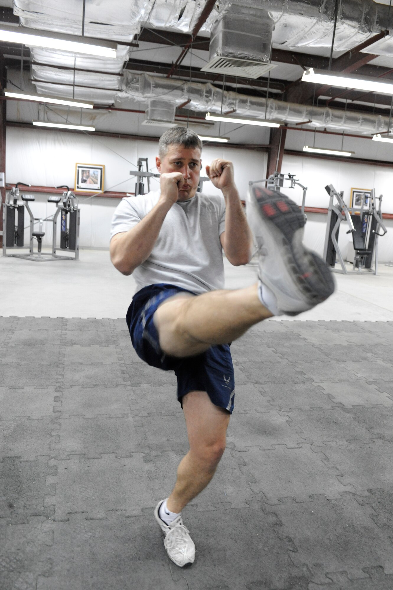 SOUTHWEST ASIA -- Master Sgt. Daniel Buse, 332nd Expeditionary Maintenance Group member, performs front kicks during a Krav Maga class at an undisclosed location in Southwest Asia, March 14, 2012. The seven-day class allowed the twelve students to train on close-quarter combat skills that may be used in real-world situations. Buse is deployed from Shaw Air Force Base, S.C., and is a native of Milwaukee. (U.S. Air Force Photo by Staff Sgt. Joshua J. Garcia)
