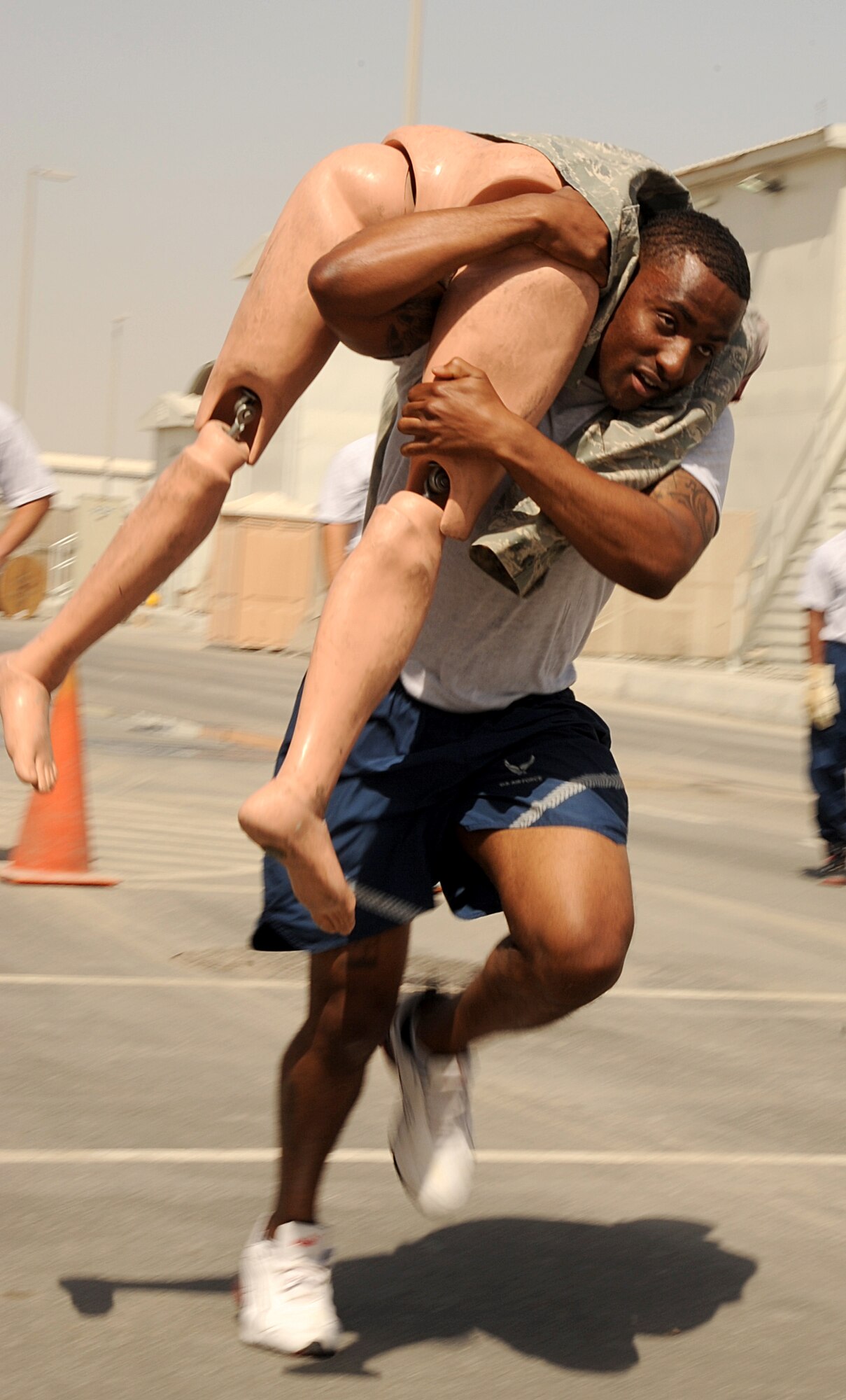SOUTHWEST ASIA - Airmen from the 380th Air Expeditionary Wing compete in a fire muster March 17, 2012.  During the fire muster, each four-person team had to accomplish five challenges based on skills firefighters hone every day. Out of the seven teams the team from the 380th Expeditionary Civil Engineer Squadron programs flight was declared the winner. (U.S. Air Force photo/Tech. Sgt. Arian Nead)  
 
