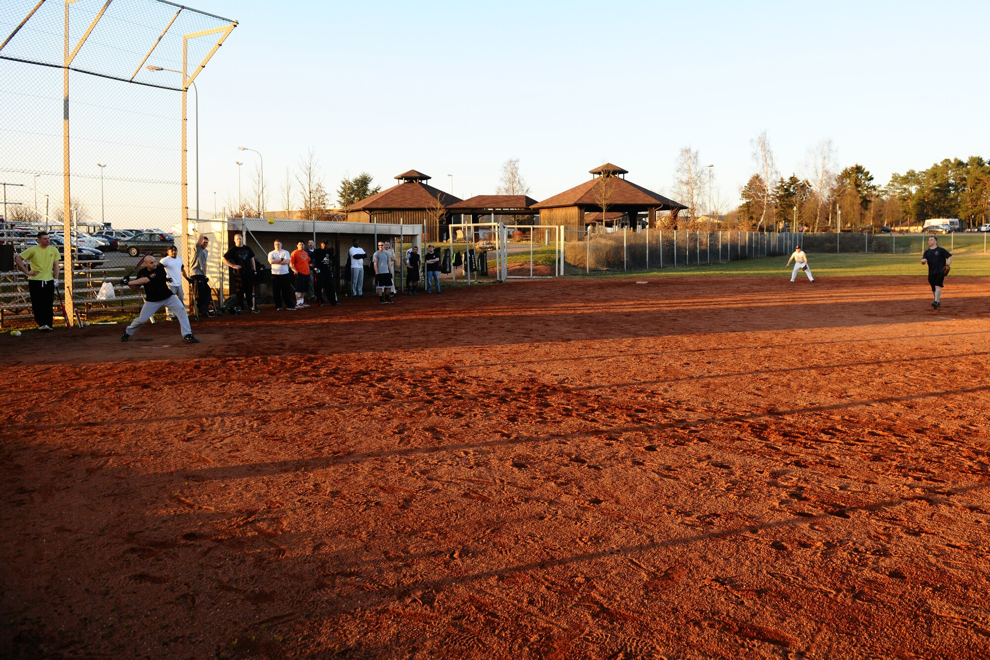 SPANGDAHLEM AIR BASE, Germany – Members of the Spangdahlem Air Base community play a scrimmage game during the men’s varsity softball tryouts held on Field 1 here March 15. The tryouts took place from March 12-16 and allowed men affiliated with the base an opportunity to try out for the team. The team will compete against other military service teams from throughout Europe during the 2012 season. (U.S. Air Force photo by Airman 1st Class Dillon Davis/Released)