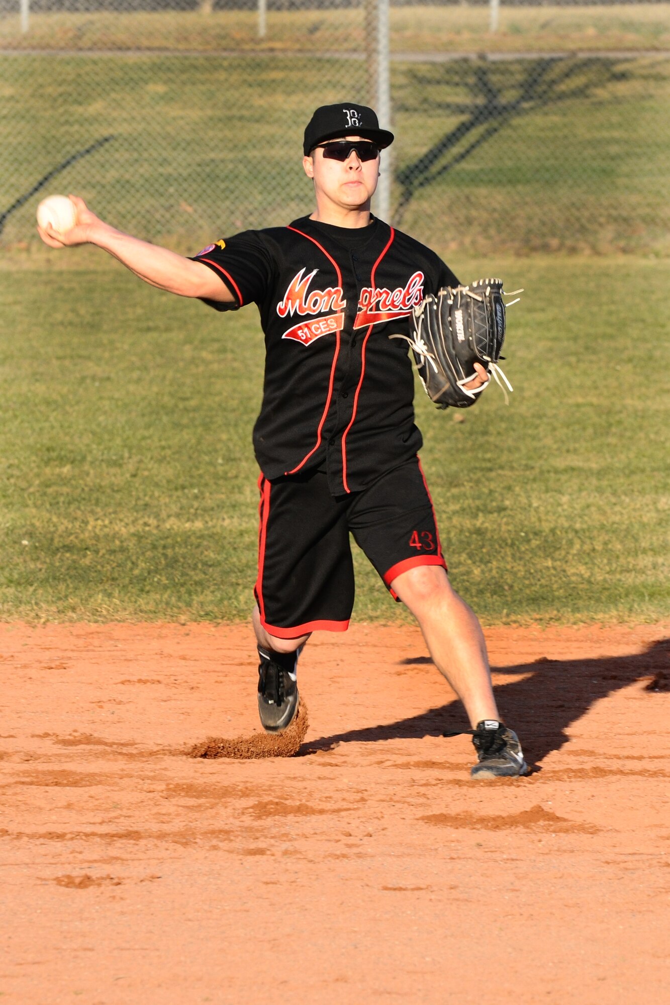 SPANGDAHLEM AIR BASE, Germany – Kyle Castonguay, 52nd Civil Engineering Squadron, throws a softball to first base during Spangdahlem men’s varsity softball tryouts held on Field 1 here March 15. The tryouts took place from March 12-16 and allowed men affiliated with the base an opportunity to try out for the team. The team will compete against other military service teams from throughout Europe during the 2012 season. (U.S. Air Force photo by Airman 1st Class Dillon Davis/Released)