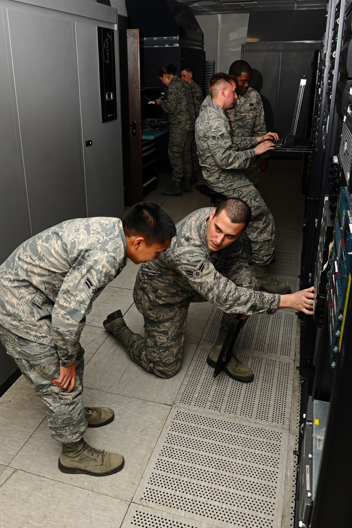 SPANGDAHLEM AIR BASE, Germany – Airmen for the 52nd Communications Squadron Systems Communications Operations Flight Cyber Operations Section maintain and repair servers at the network control center here March 15. The 52nd CS Systems Communications Operations Flight Cyber Operations Section develops and maintains foundational communication capabilities for the 52nd Fighter Wing by providing network services including messaging, share drives, and network access and storage to the base and its geographically-separated units. (U.S. Air Force photo by Airman 1st Class Matthew B. Fredericks/Released)