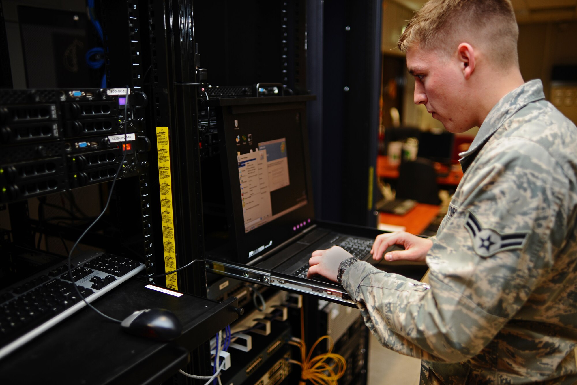 SPANGDAHLEM AIR BASE, Germany – Airman 1st Class Craig Evans, 52nd Communications Squadron cyber operations journeyman, configures a server to be used for training at the network control center here March 15. The 52nd CS Systems Communications Operations Flight Cyber Operations Section develops and maintains foundational communication capabilities for the 52nd Fighter Wing by providing network services including messaging, share drives, and network access and storage to the base and its geographically-separated units. (U.S. Air Force photo by Airman 1st Class Matthew B. Fredericks/Released)