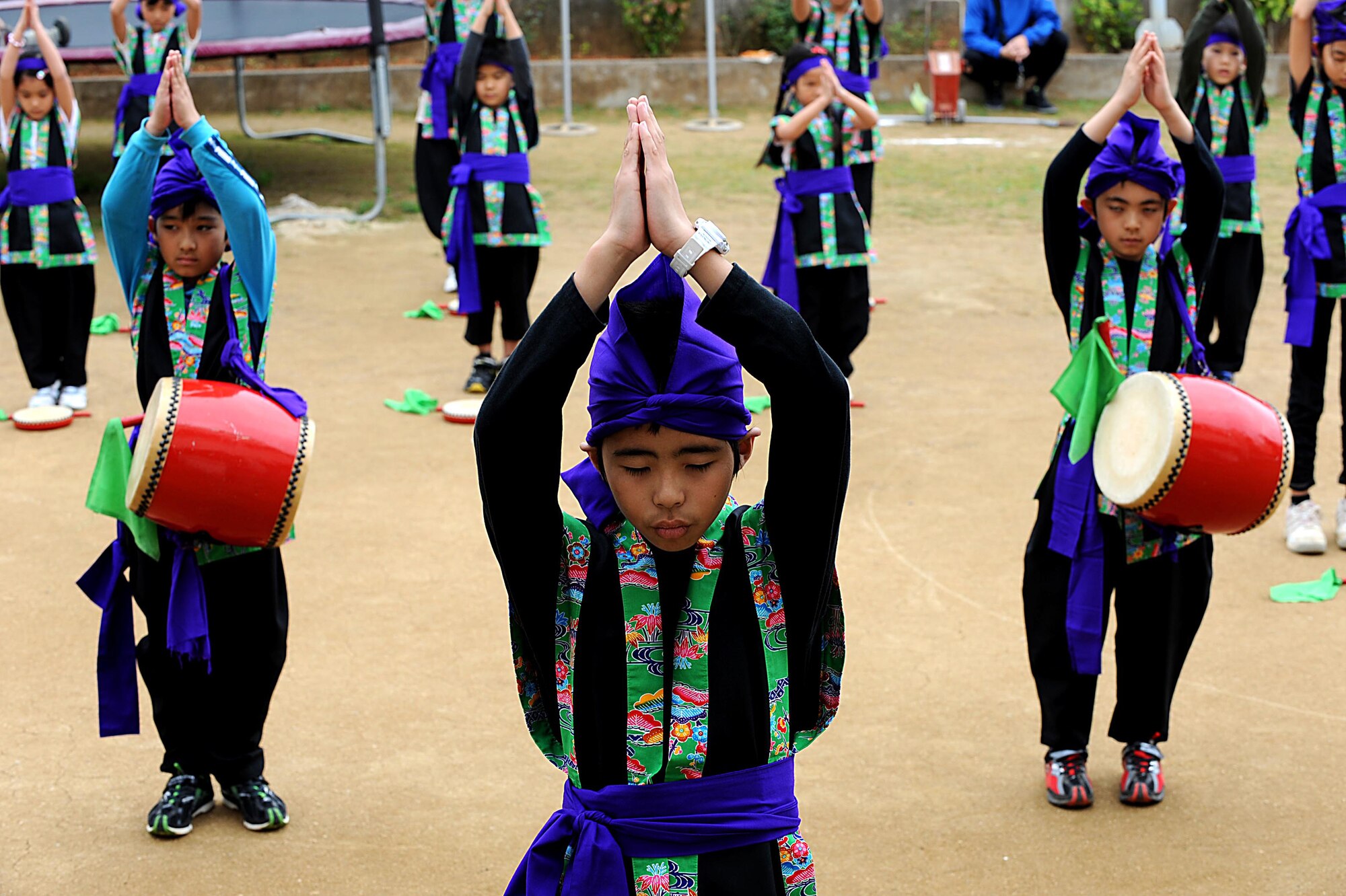 Children from Chatan Town's Busy Bee School perform an Eisa dance during their friendship day on Okinawa, March 17, 2012. Unlike American schools, attended Monday through Friday, students at Busy Bee attend school Monday through Saturday. (U.S. Air Force photo by Airman 1st Class Brooke P. Beers/Released)