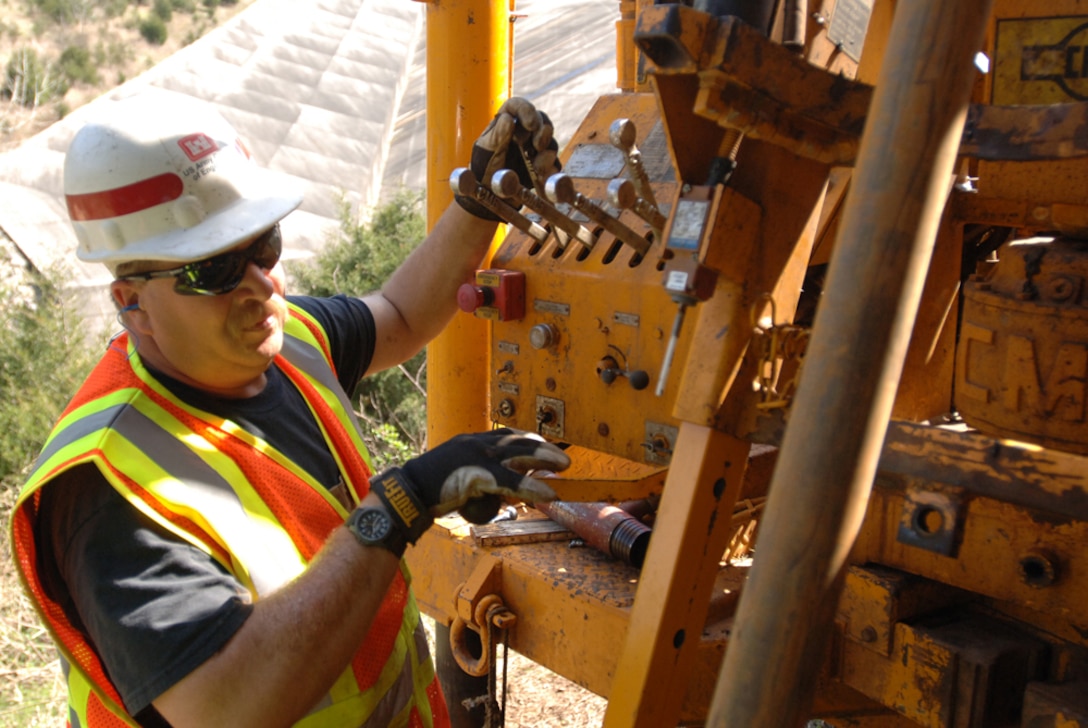 Drill Rig Operator John Blackson, U.S. Army Corps of Engineers Baltimore District, works on a rig near the Saddle Dam at Center Hill Lake in Silver Point, Tenn., March 14, 2012.  The Baltimore District is supporting the Nashville District with exploratory drilling capabilities.  The Nashville District's geologists are working alongside the drill rig to analyze core samples. 