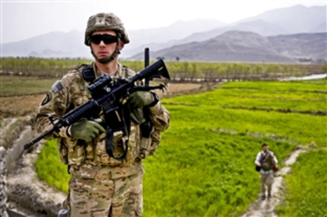 U.S. Air Force Staff Sgt. Christopher Hobbs maintains security for an inspection team in Jalalabad, Nangarhar province, Afghanistan, March 18, 2012. Hobbs is assigned to the Nagarhar Agribusiness Development Team, which supports initiatives to ensure the sustainability of Afghan agricultural productivity.