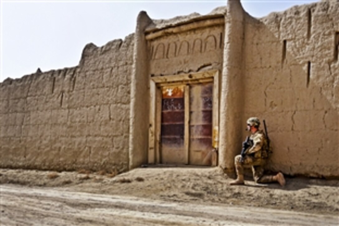 U.S. Army 1st Lt. Seth Curry secures an entrance in the village of Sader Kheyl near Combat Outpost Rahman Kheyl, Afghanistan, March 17, 2012. Curry is an excutive officer assigned to  Company B, 3rd Battalion, 509th Infantry Regiment.