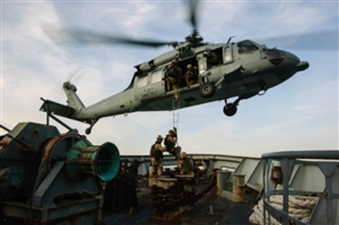 A U.S. Navy MH-60S Seahawk helicopter attached to Helicopter Sea Combat Squadron 28 conducts a shipboard extraction from an Italian Navy training vessel in the Gulf of La Spezia on March 13, 2012.  