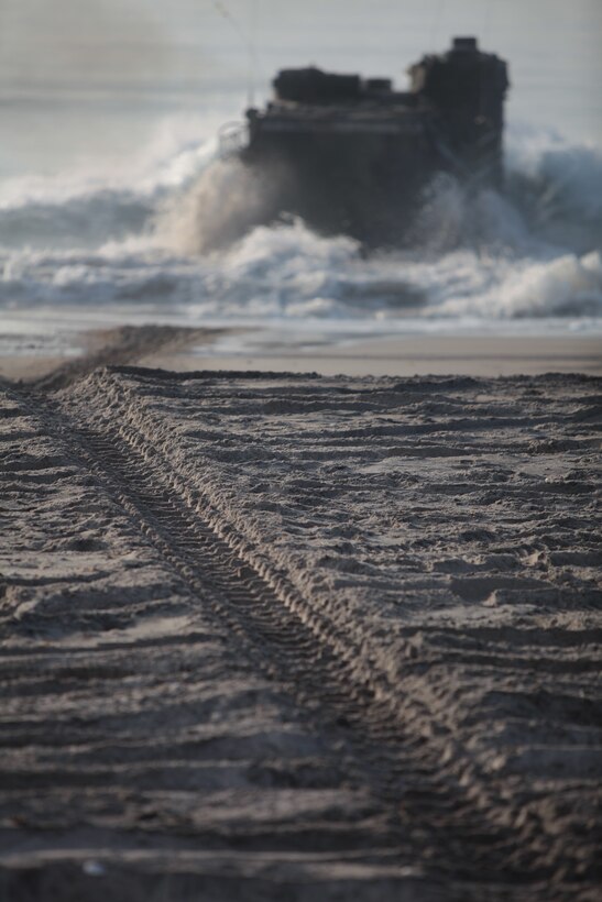 An Amphibious Assault Vehicle with 3rd Platoon, Delta Compay, 2nd Assault Amphibian Battalion, 2nd Marine Division, begins its 45-minute trek to the USS Whidbey Island March 20 at Onslow Beach aboard Marine Corps Base Camp Lejeune. Thirty-six Marines with the platoon conducted reintegration exercises from March 19 – 22 in preparation for their deployment with the Africa Partnership Station 2012 this year.