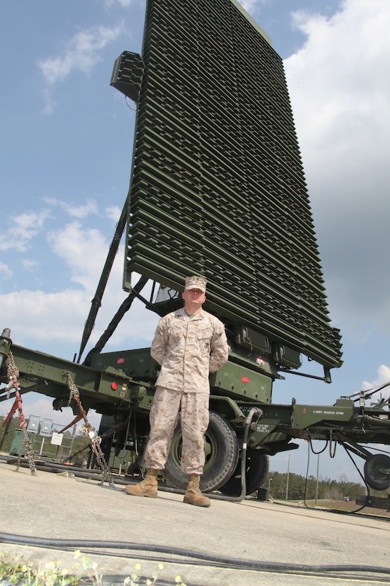 Sgt. William T. Carey a radar repairman with Marine Air Control Squadron 2, stands in front of a radar system at the MACS-2 headquarters aboard Marine Corps Air Station Cherry Point March 20. Carey's job is to keep the large-scale radar systems up and running. “It is my job to maintain and operate these radar systems here at Marine Air Control Squadron 2,” said Carey. “I perform preventive maintenance and corrective maintenance as well.” ::r::::n::