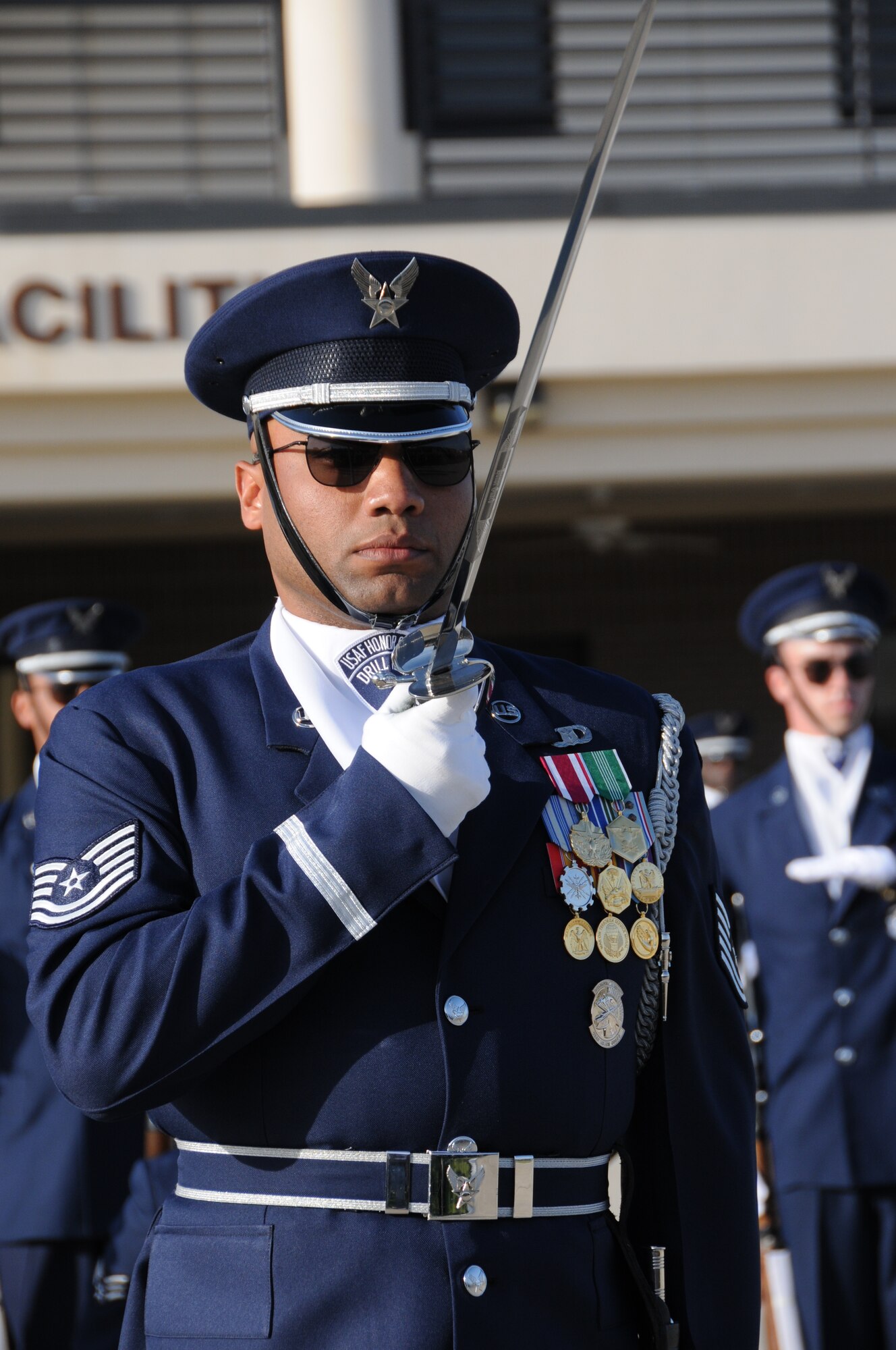 The U.S. Air Force Honor Guard Drill Team executes the newly unveiled 16-man drill performance March 6 on Keesler Air Force Base, Miss. Drill Team members attended a month long training camp in which they revamped drills, giving them a new edge for upcoming 2012 performances. Airmen from Keesler were among the first to witness the newly choreographed routine. (U.S. Air Force by Kemberly Groue) 
